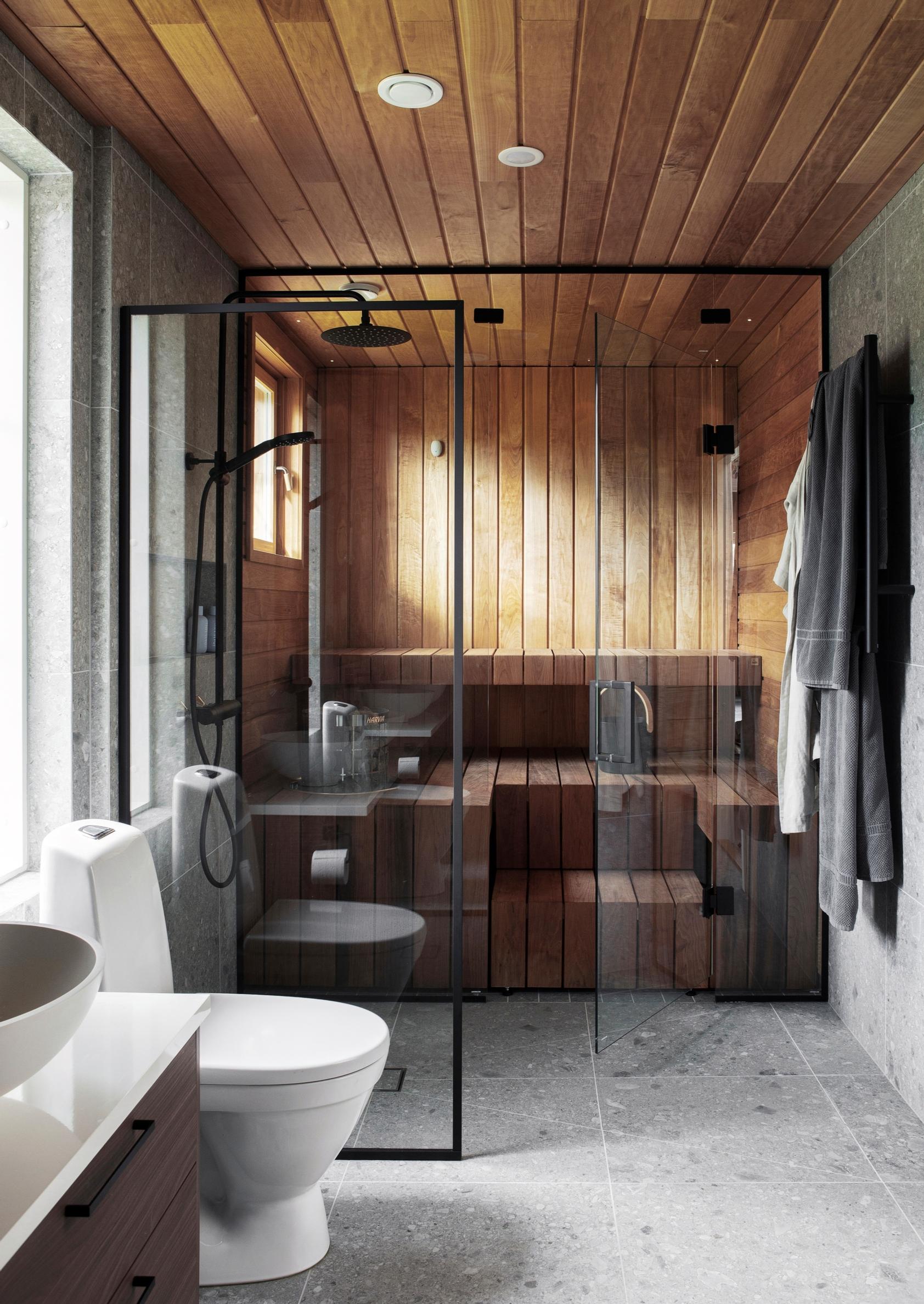 Terrazzo tiling on walls and floor in the sauna’s washing area