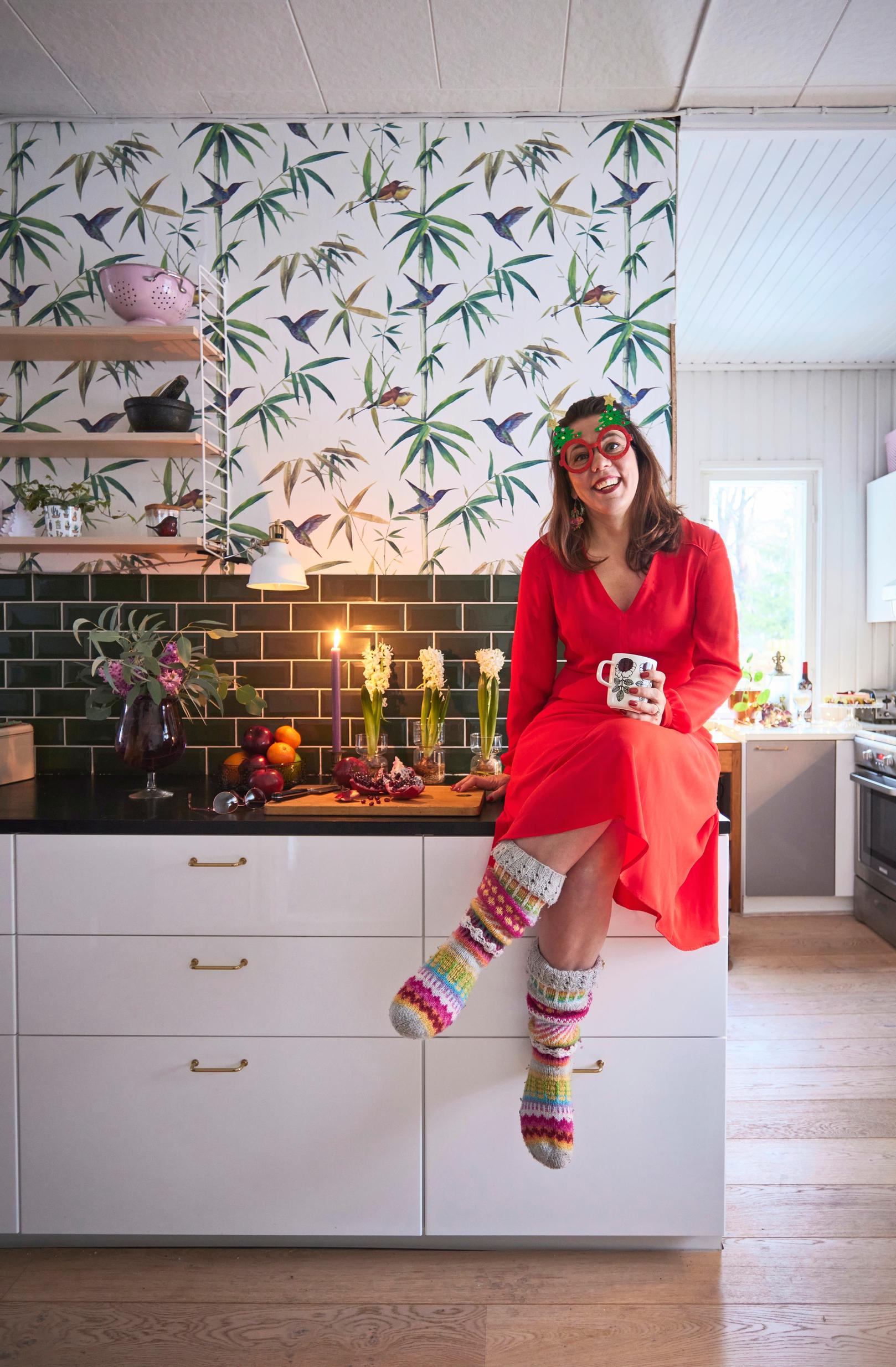 Elisa sits on the kitchen counter