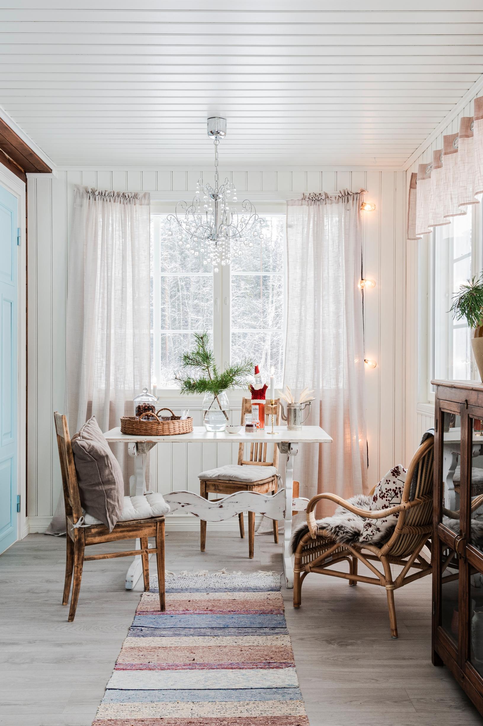 A porch with light-tone furnishing