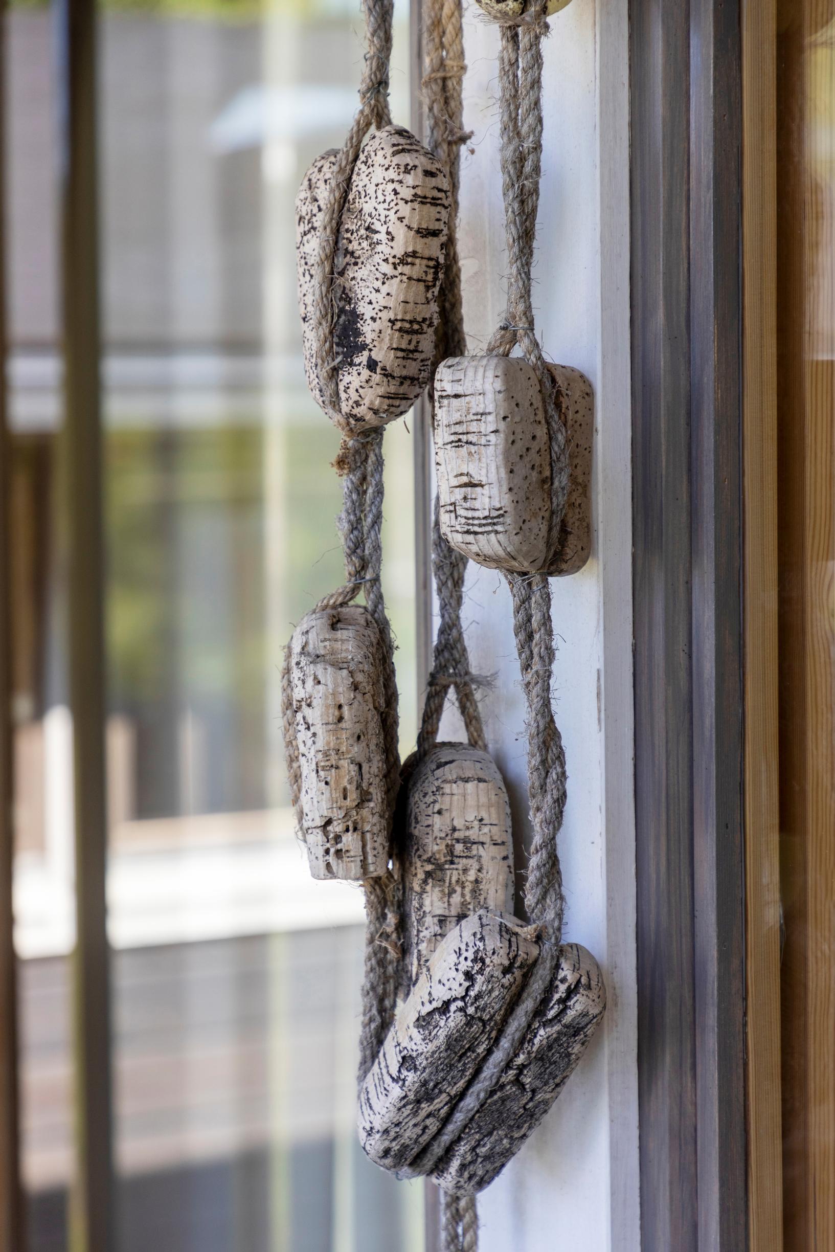 cork net floats hanging on display