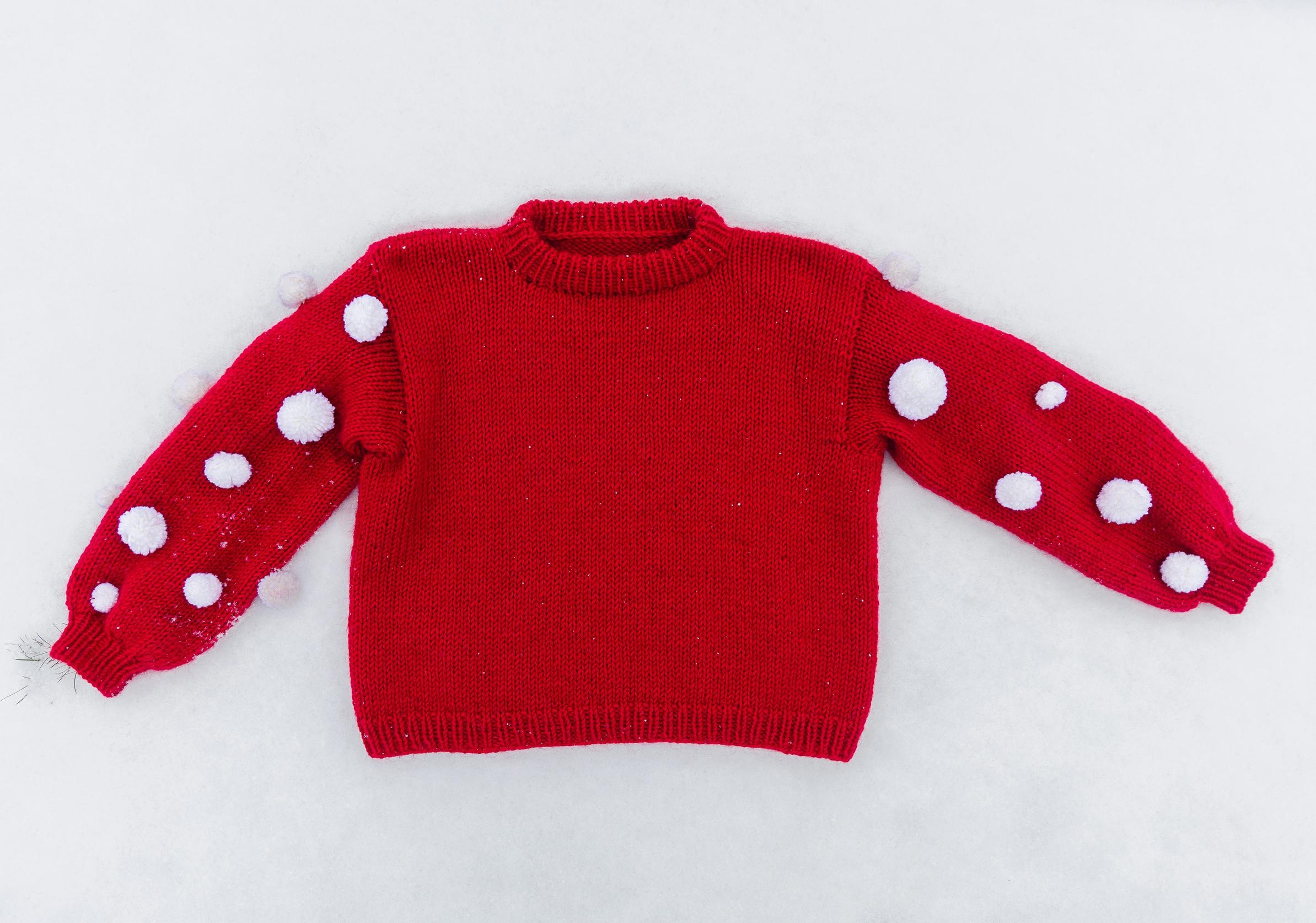 Christmas sweater decorated with pompoms