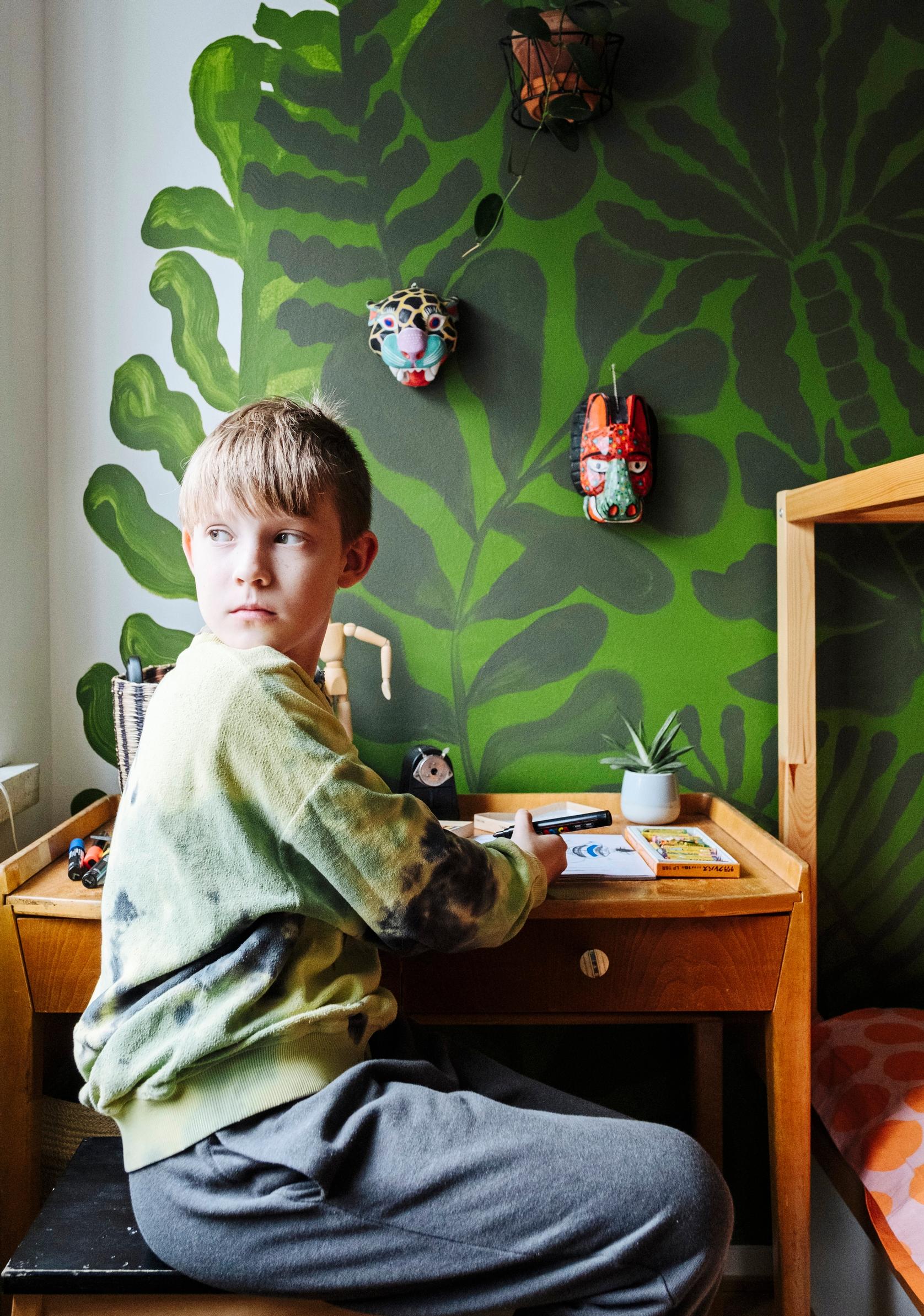 The family’s child at a desk