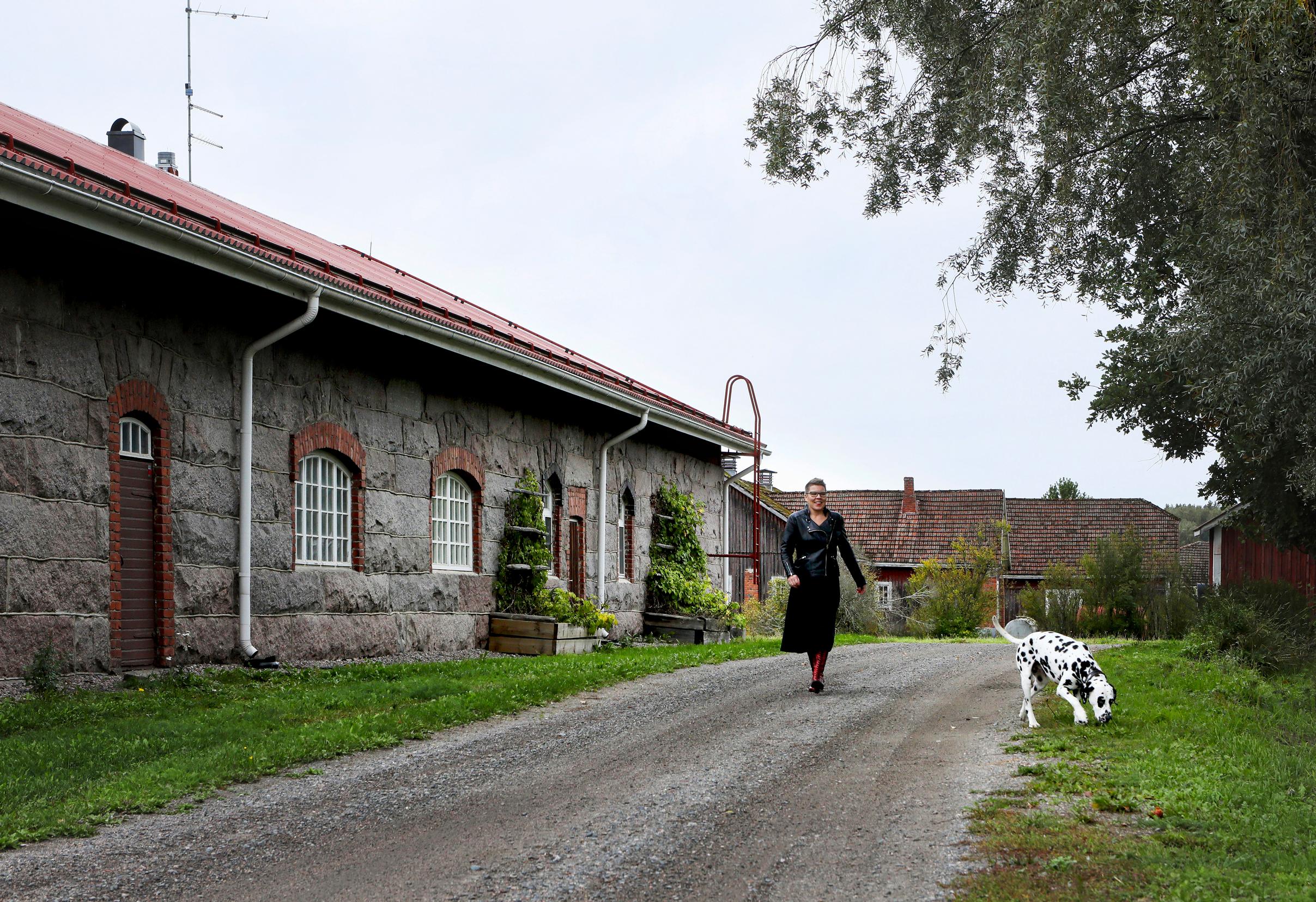 Maria Lassila-Merisalo on the yard path