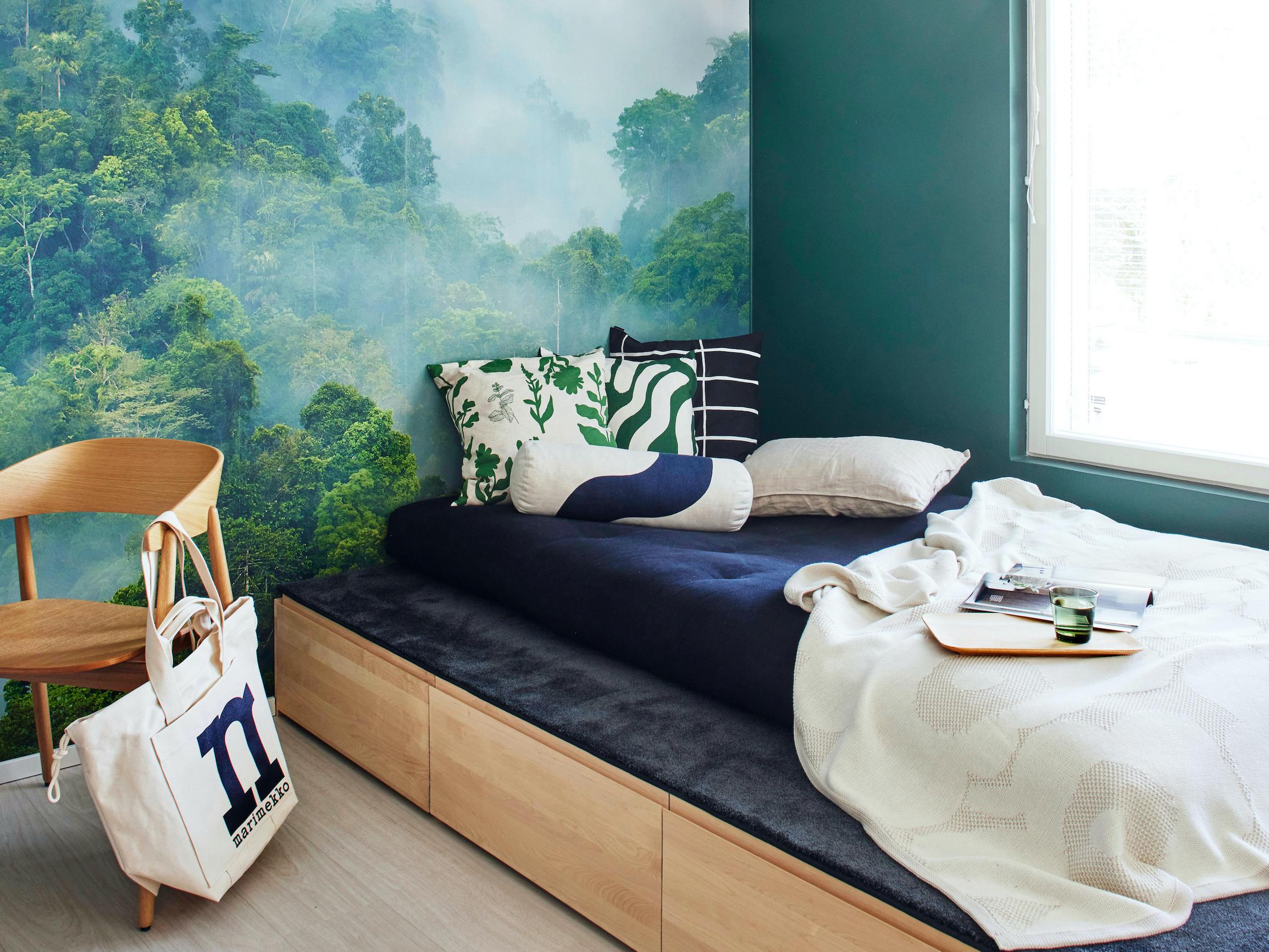 Ingenious multifunctional furniture: this space-saving sleeping platform serves as a guest bed, a lounge spot, and storage drawers