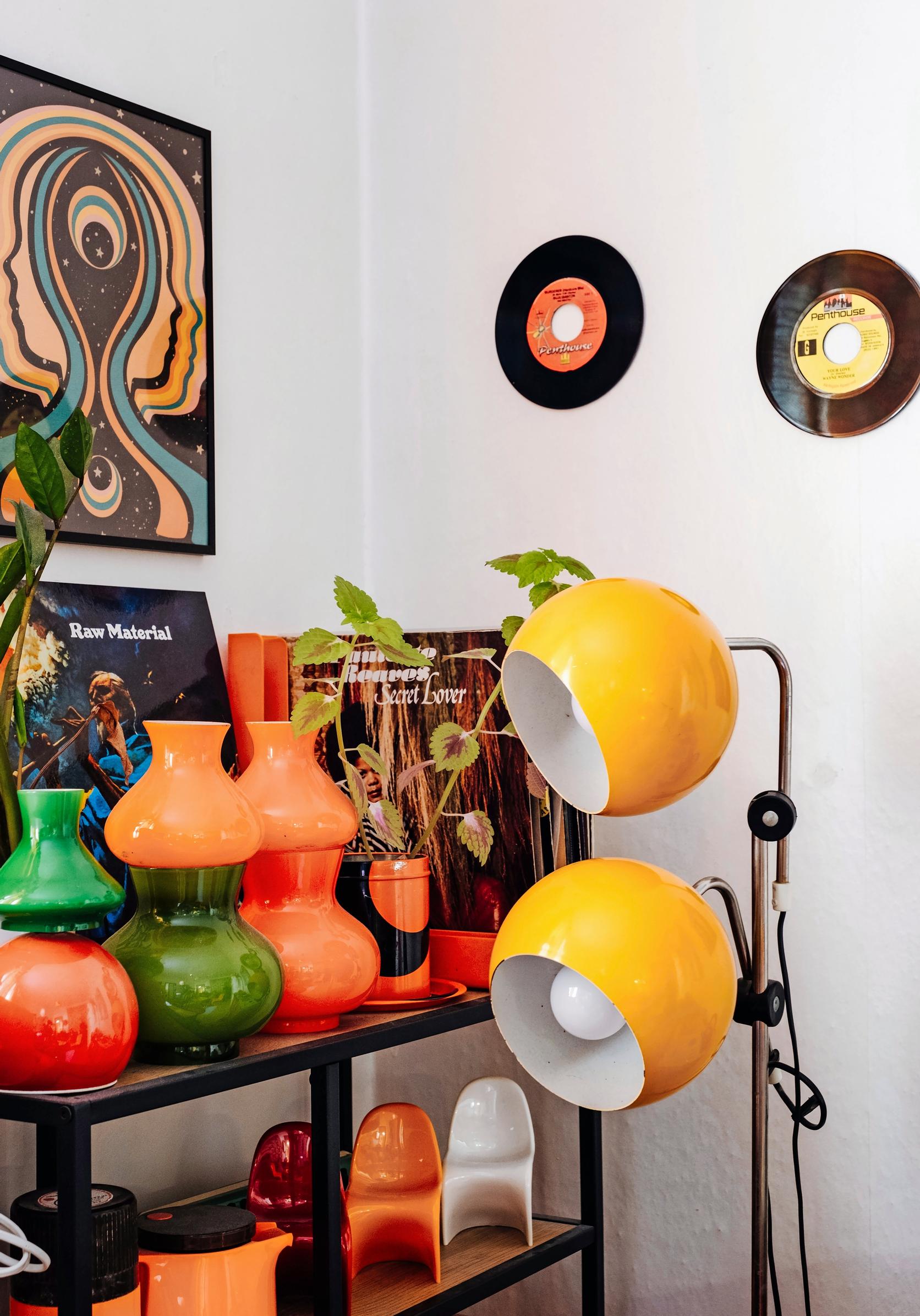 Photo of a vintage collection that includes plastic Panton chairs.