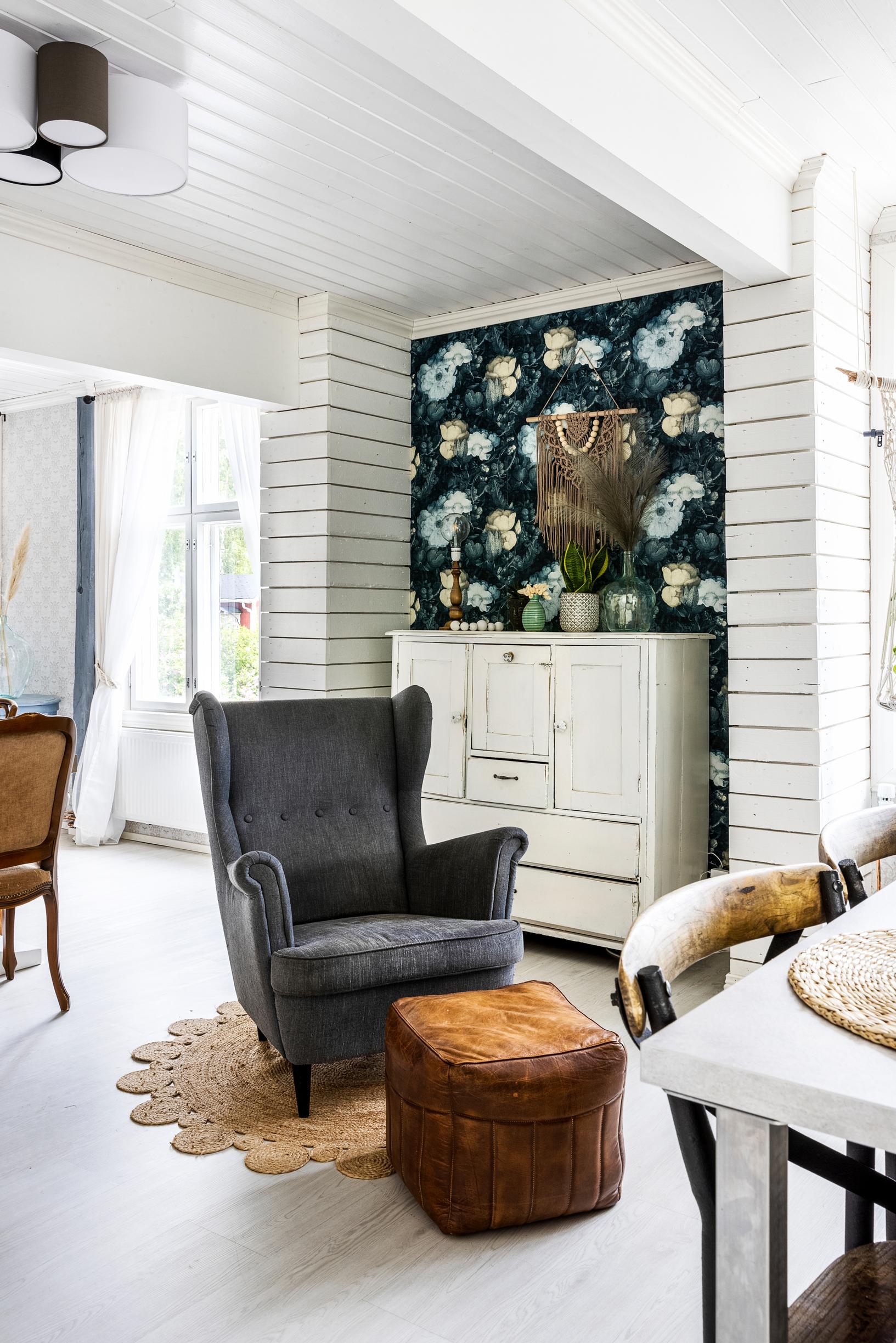 A gray armchair and a cognac-colored ottoman