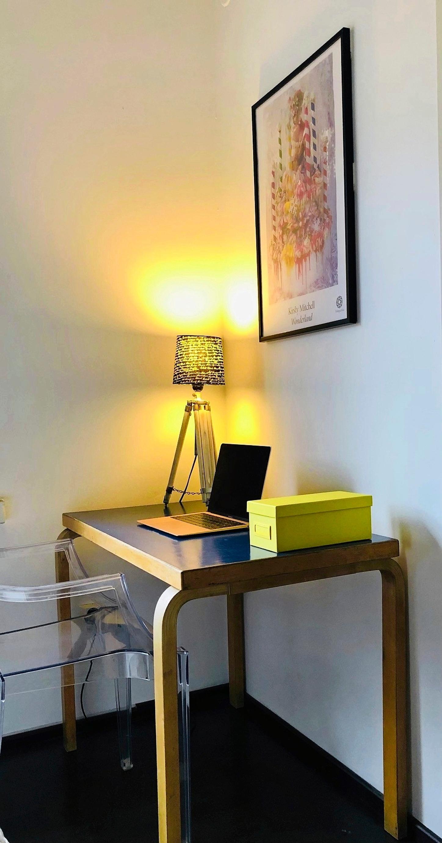A blue-topped Artek table