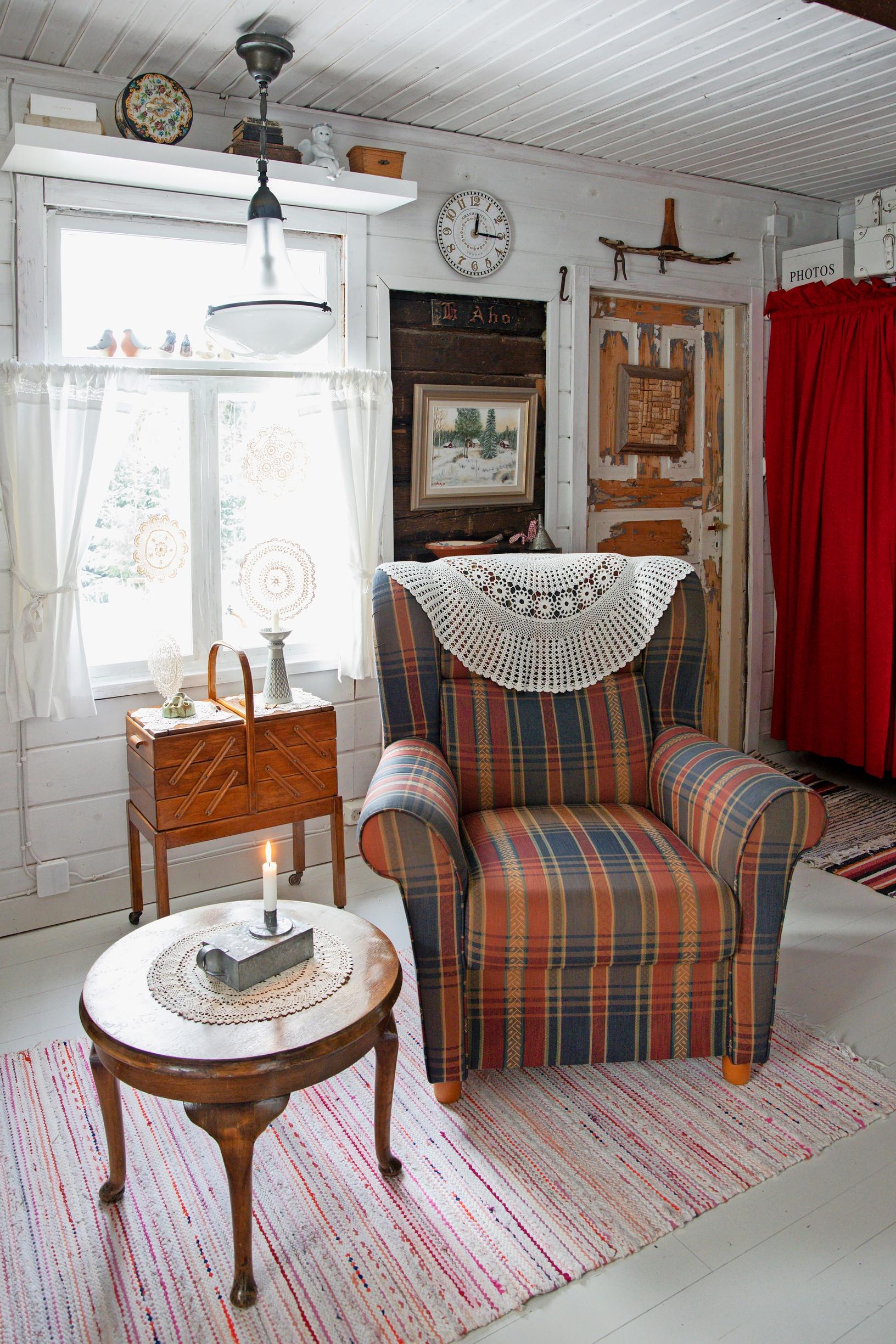 a striped armchair, a coffee table, and a rag rug