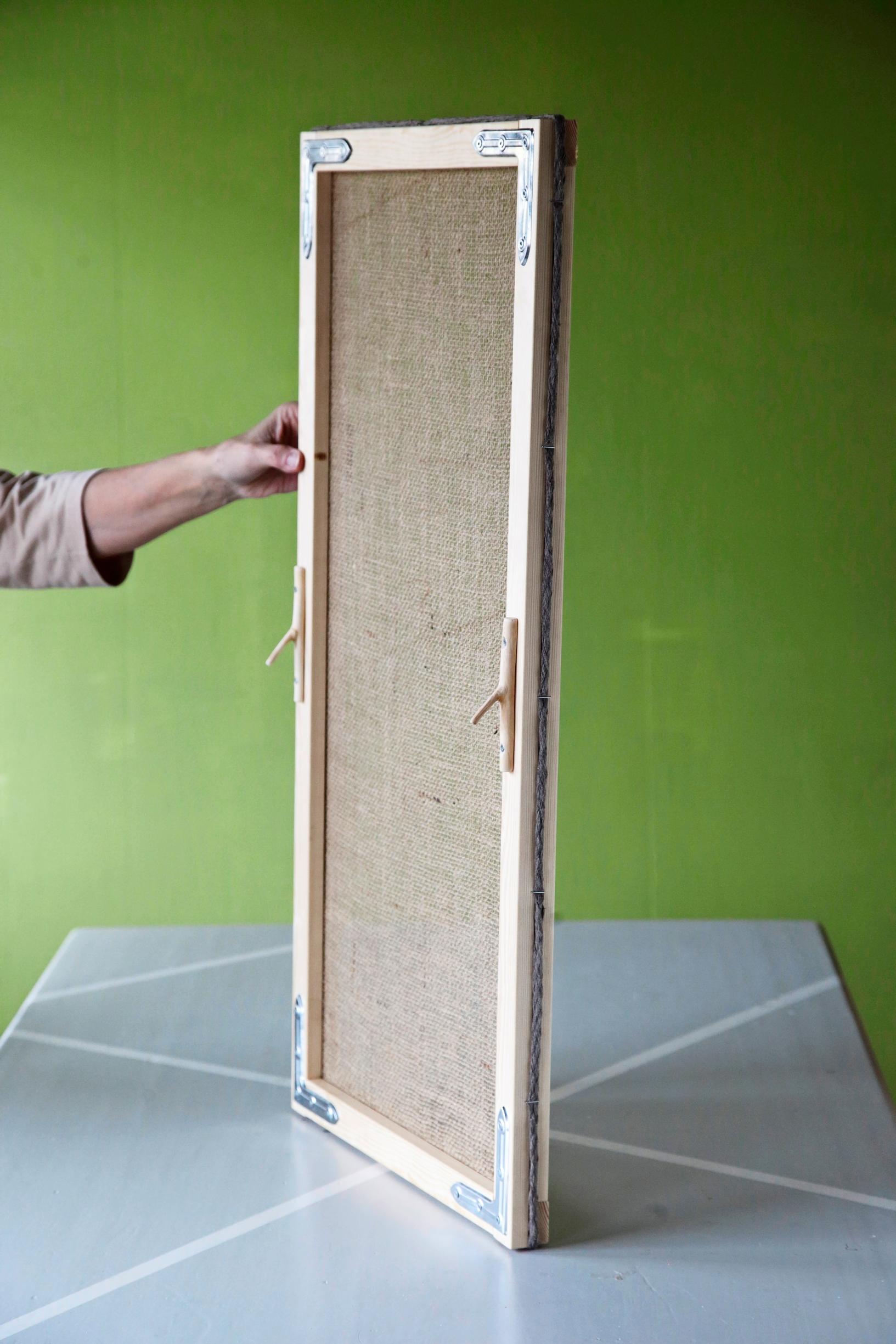 The finished mosquito net ready to be placed in the window