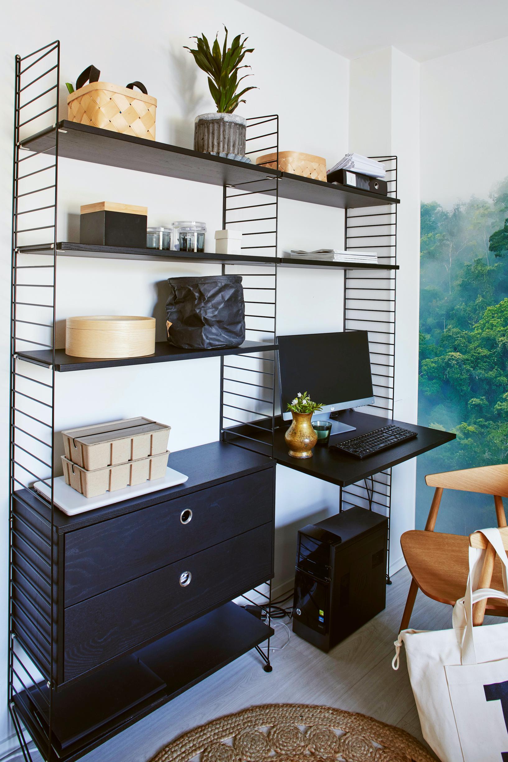 A dark storage unit with drawers, shelves, and a desktop.