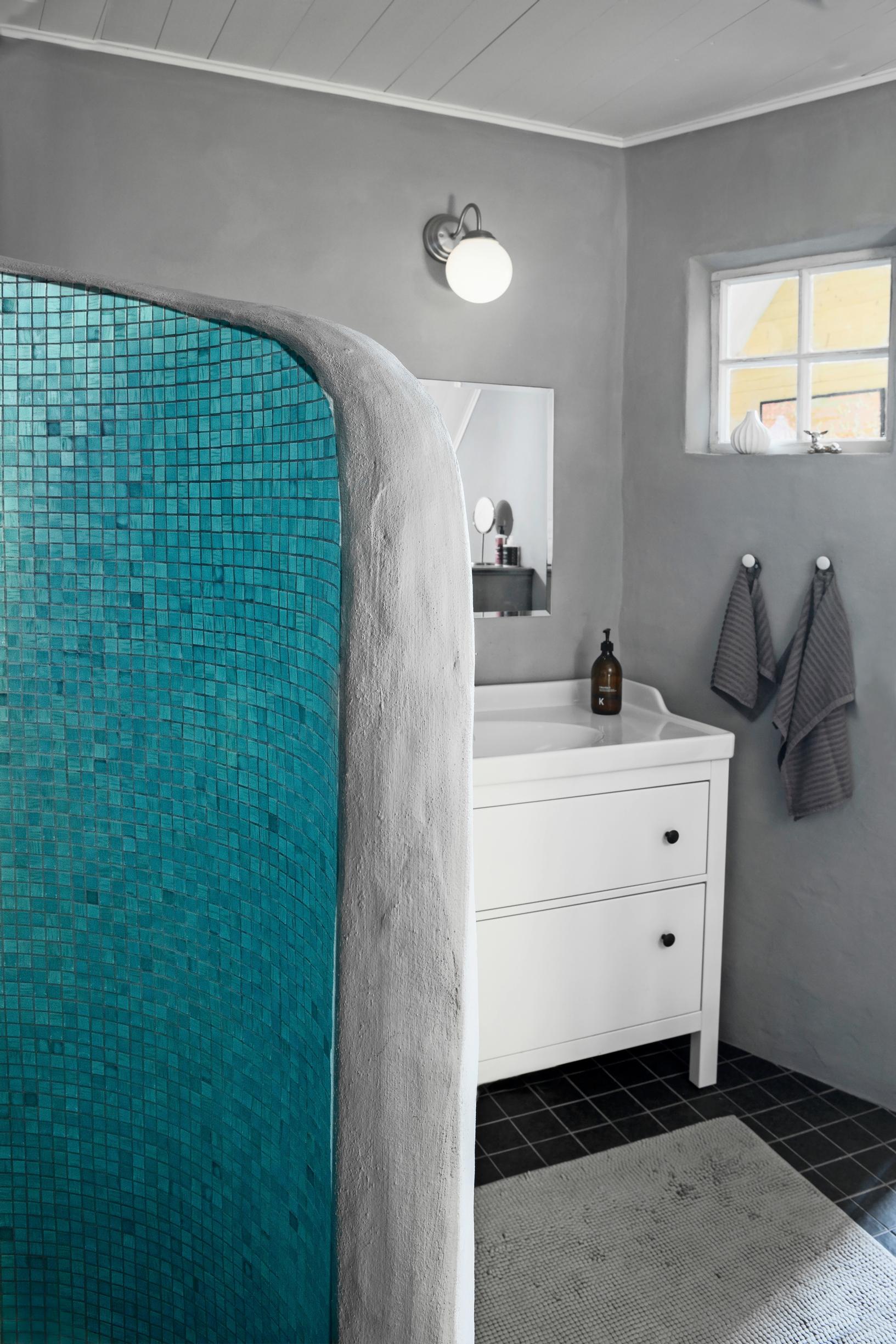 Mosaic tiles in the shower corner