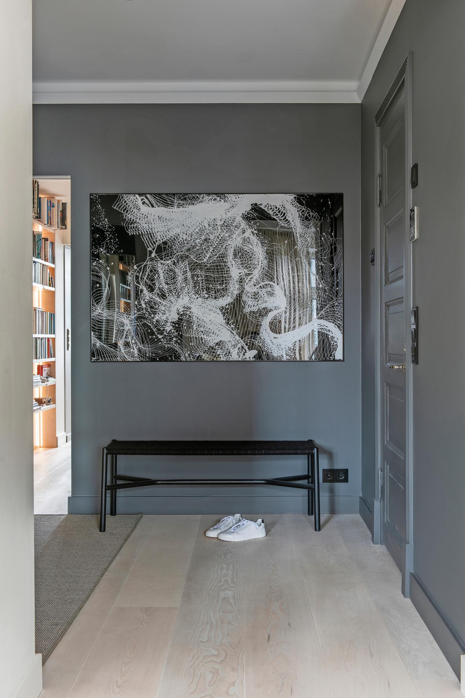 The unexpectedly dark entryway in this otherwise light-toned home