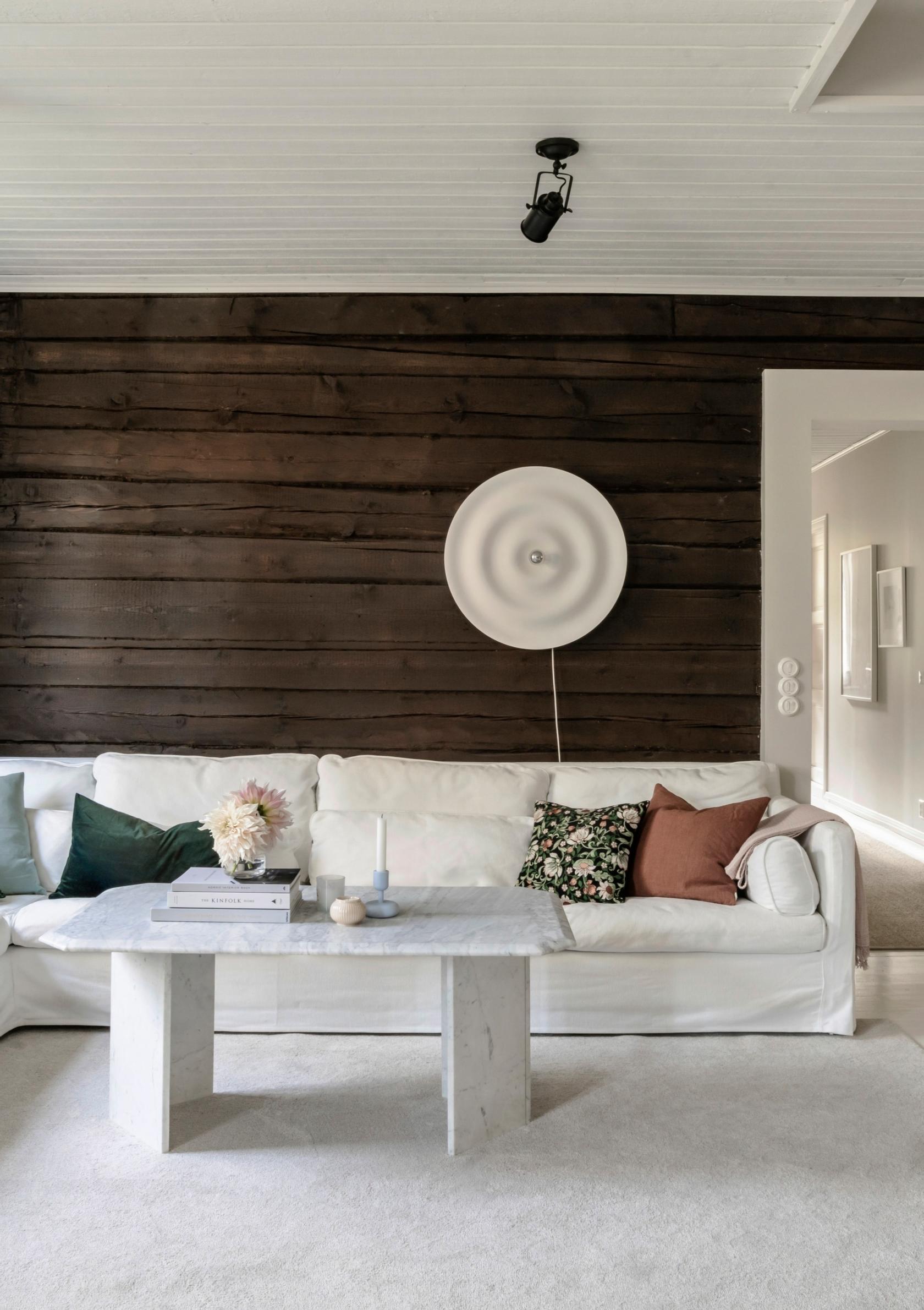 A log wall waxed in an antique oak shade