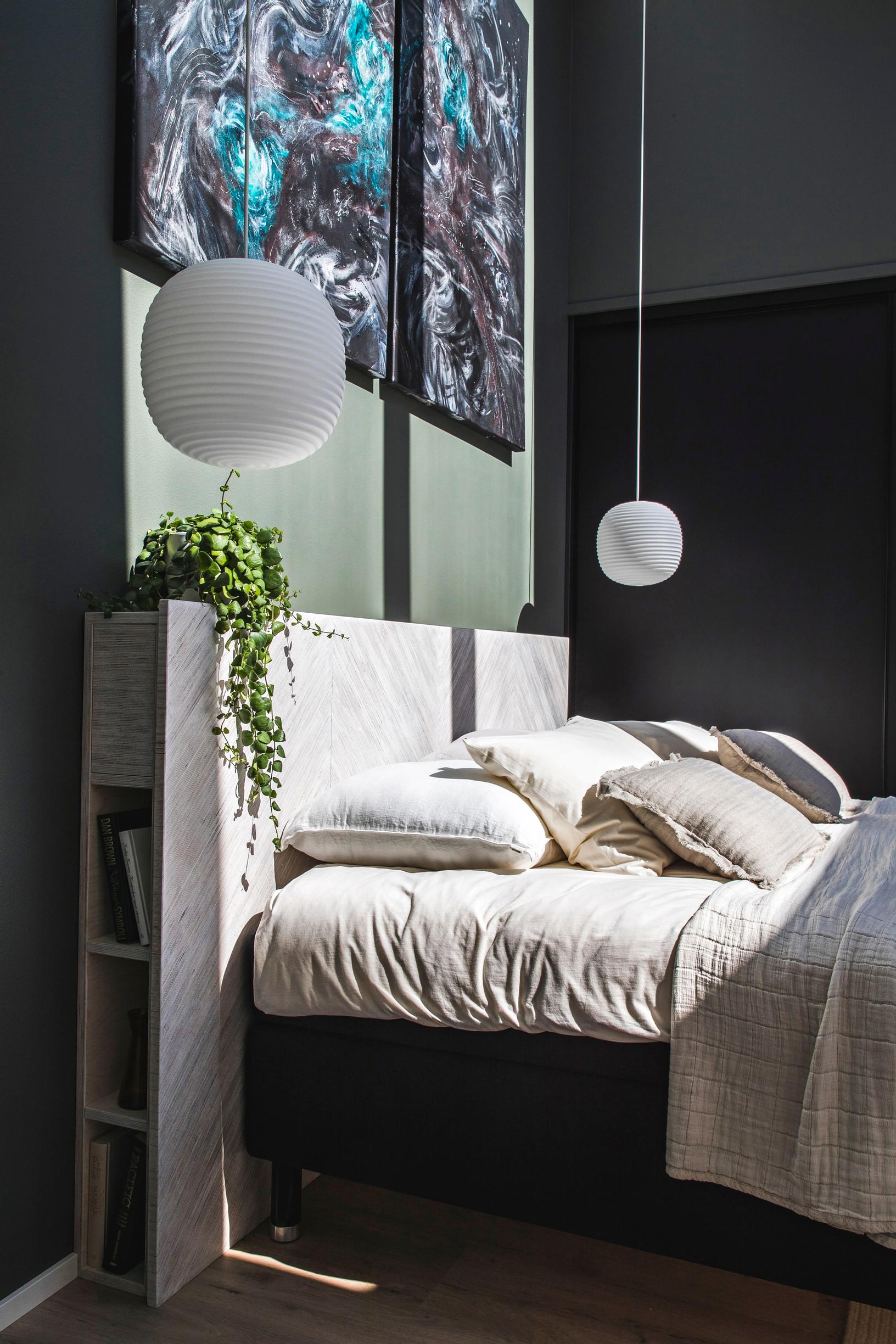 Bedside lights hanging from the ceiling