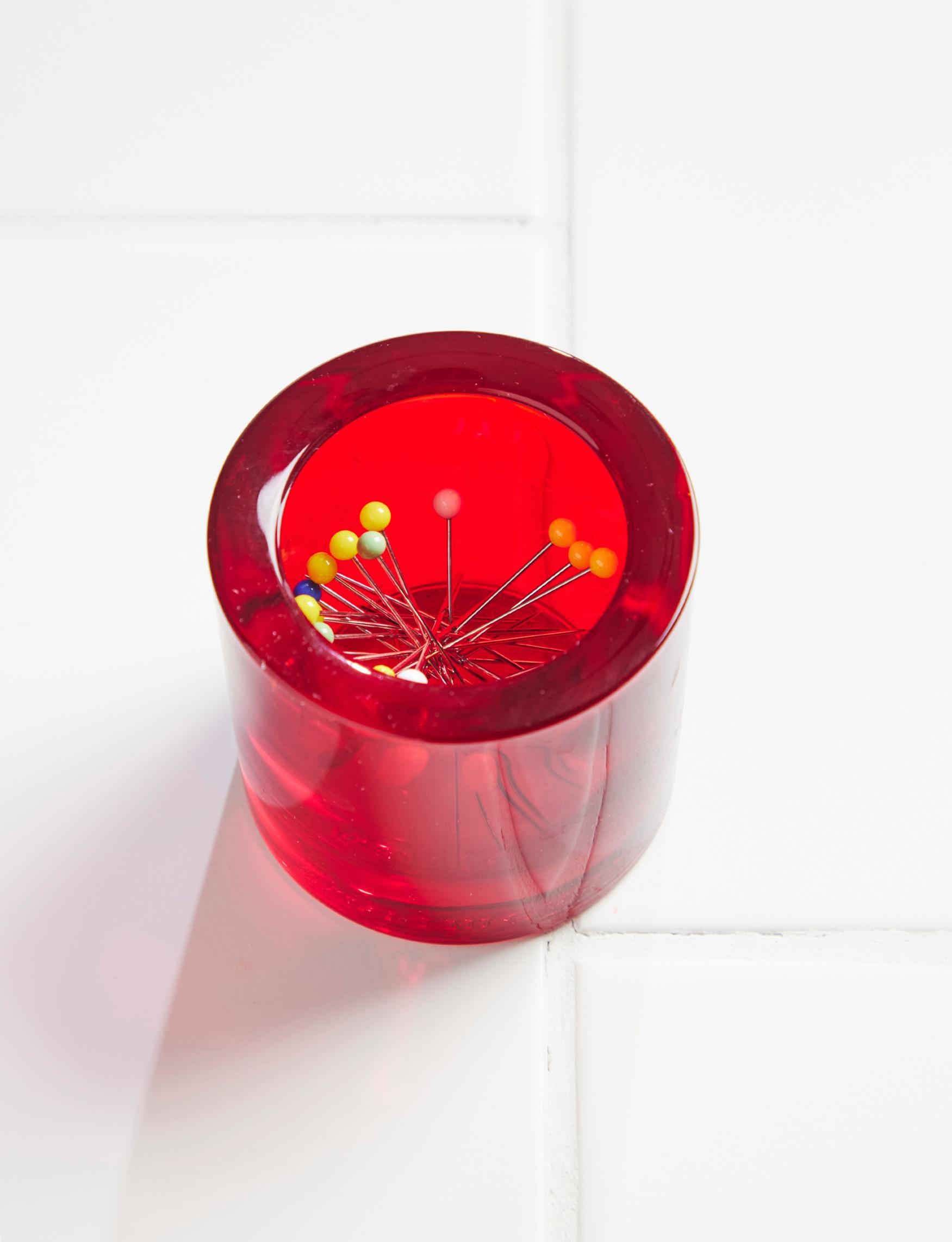 Pins in a Kivi tea light holder.