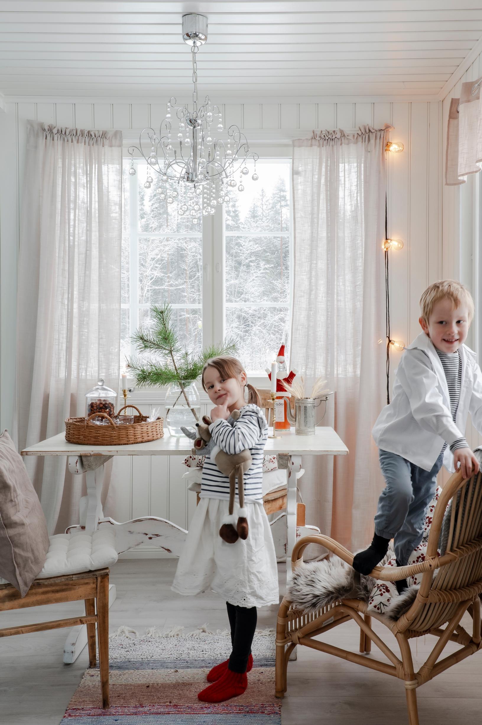 The children are playing on the porch