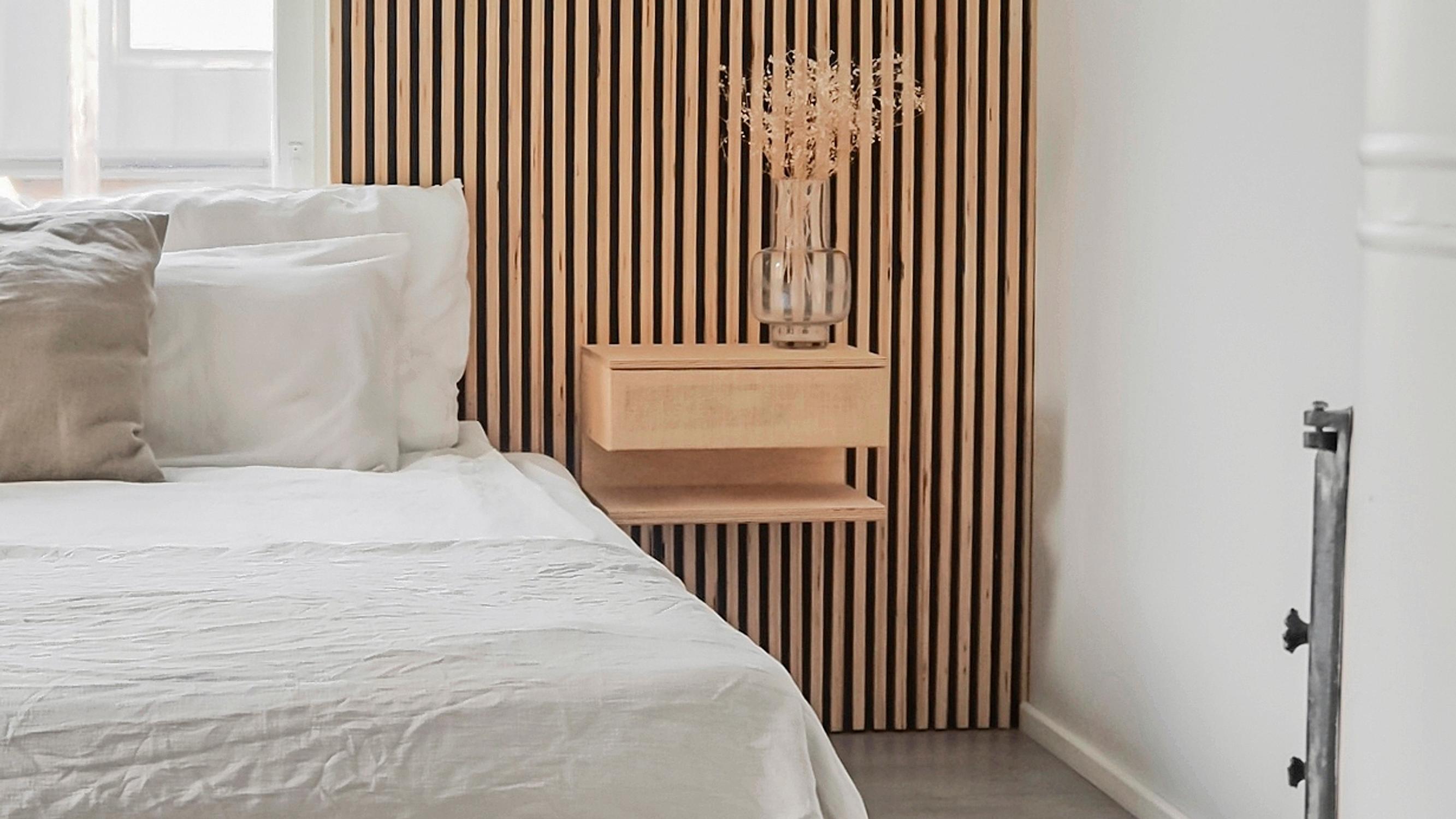 Make a sleek wall-mounted bedside table that fits even the smallest space