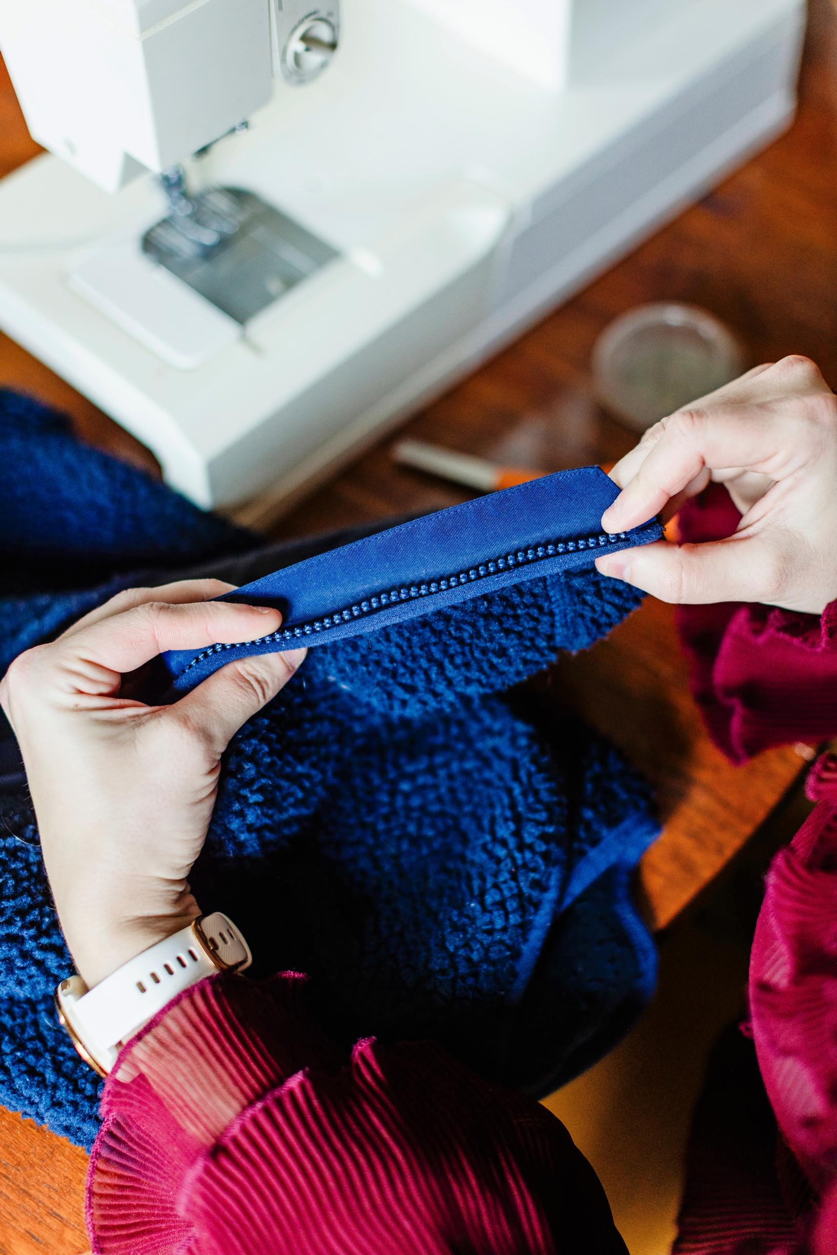 A close-up of a zipper repair.