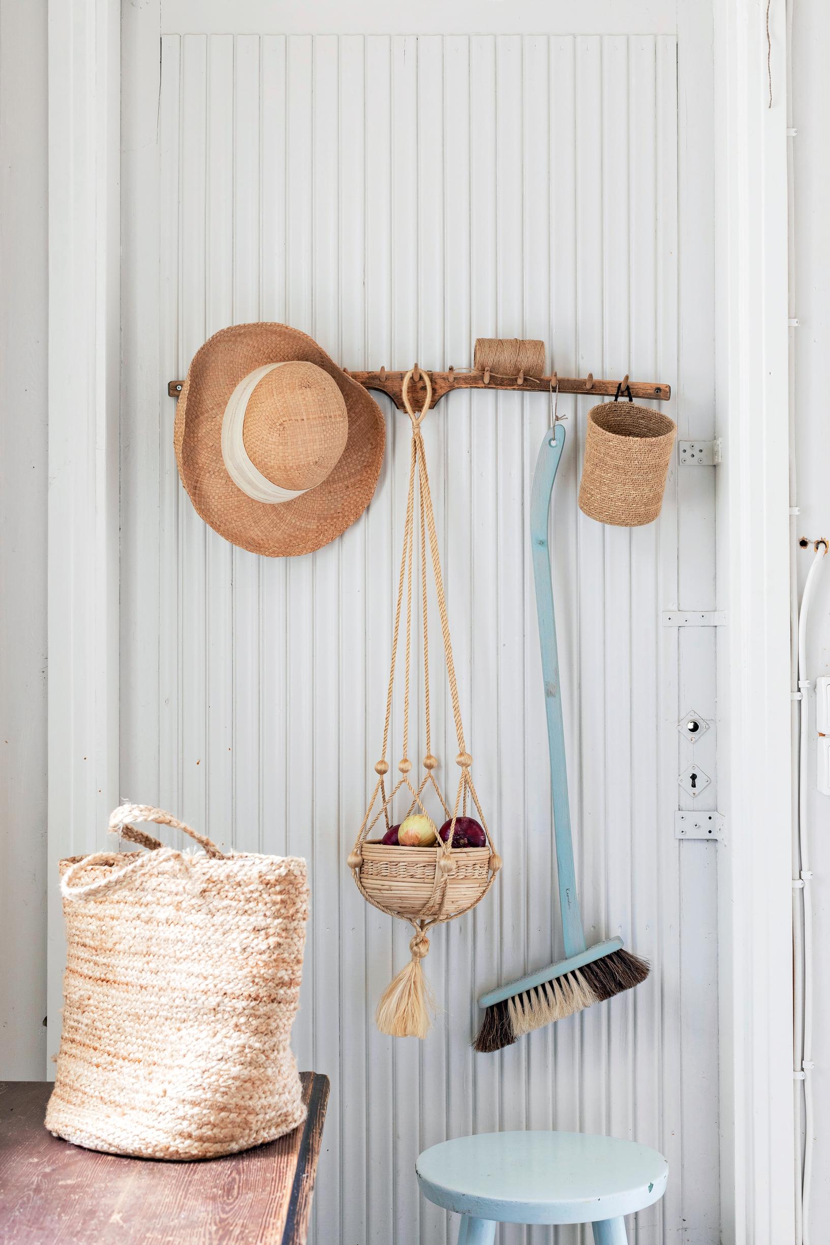 An old wooden rake used as a coat rack