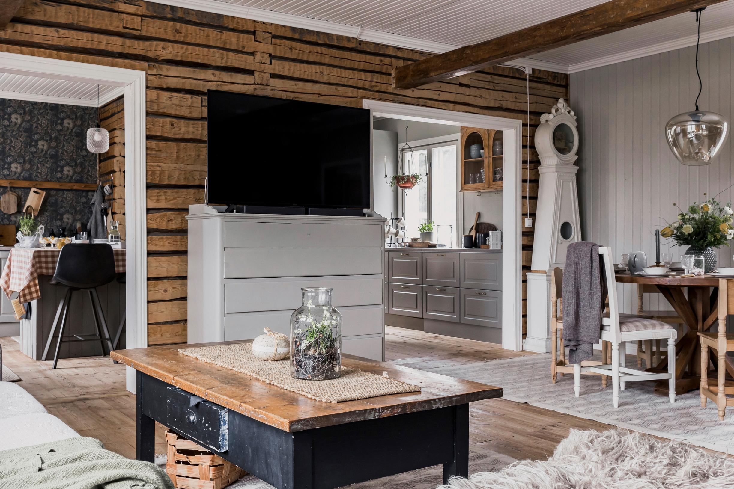 living room with a TV on a cabinet