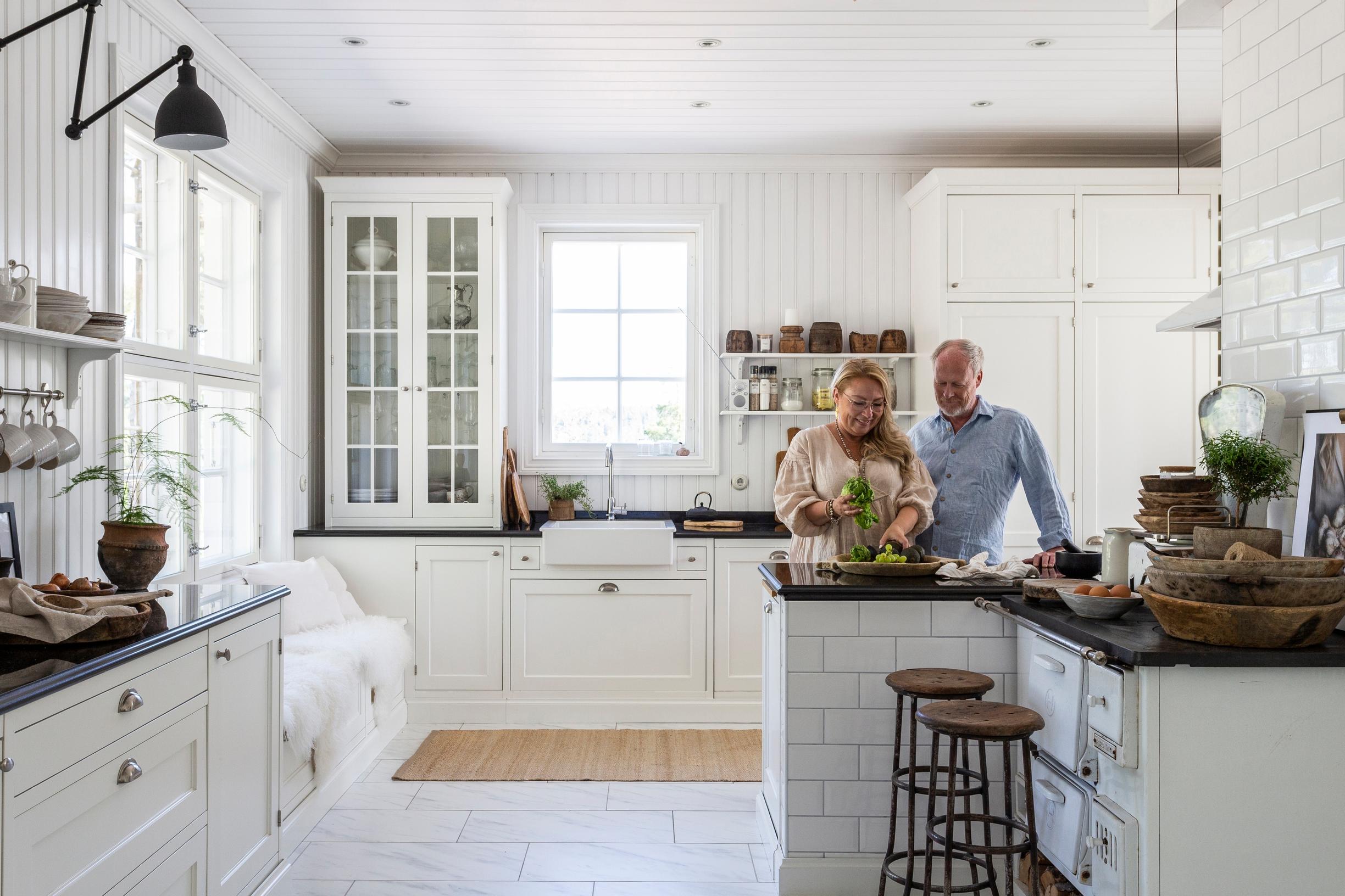 Pia and John’s villa-esque kitchen with a marble-patterned tile floor