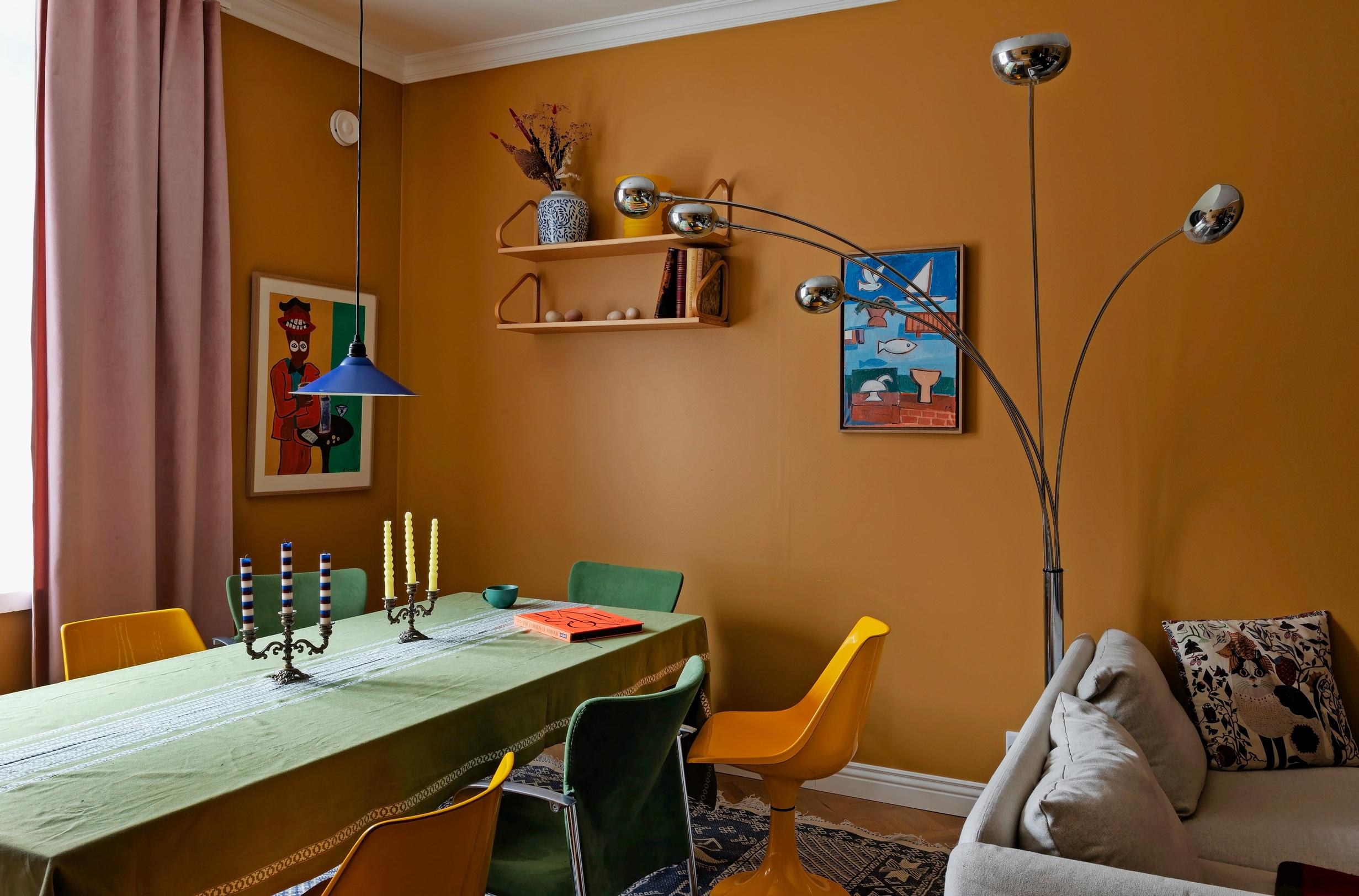 Image of a living room dining set with various vintage chairs.