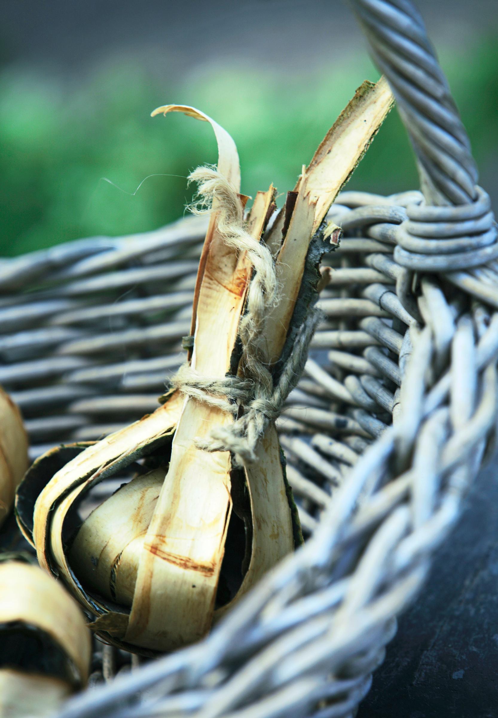 A finished onion-shaped fire starter in a basket.