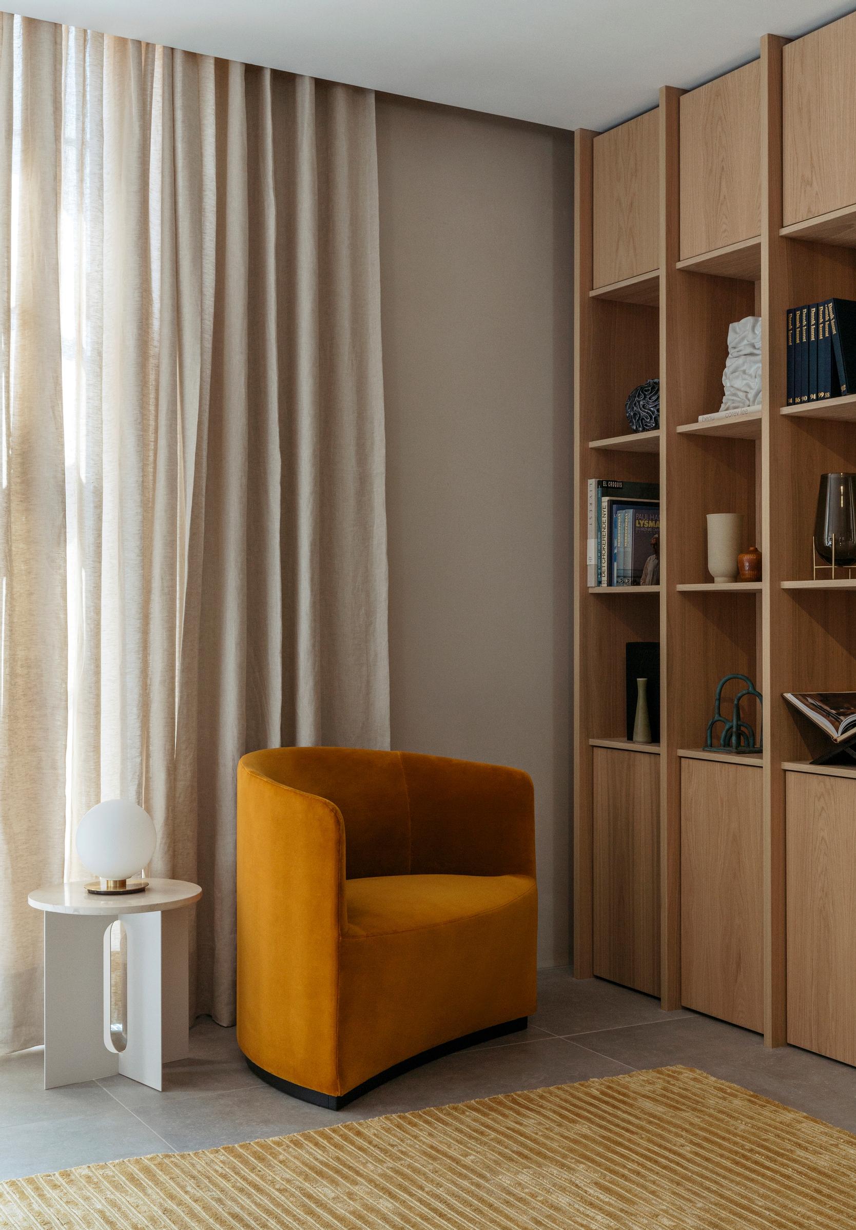 Curtain track recessed into a niche between ceiling and wall