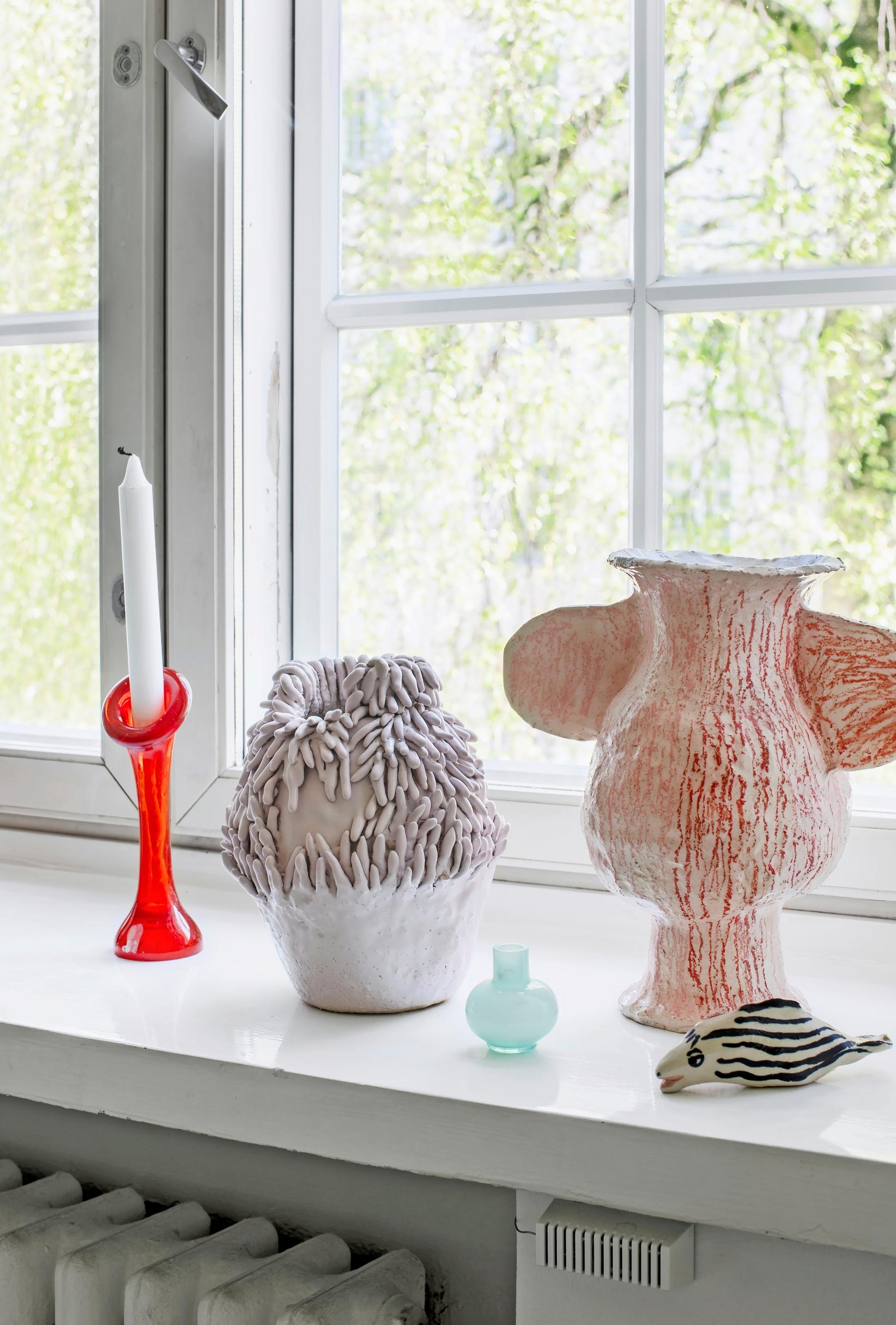 Ceramics and glass displayed on the windowsill