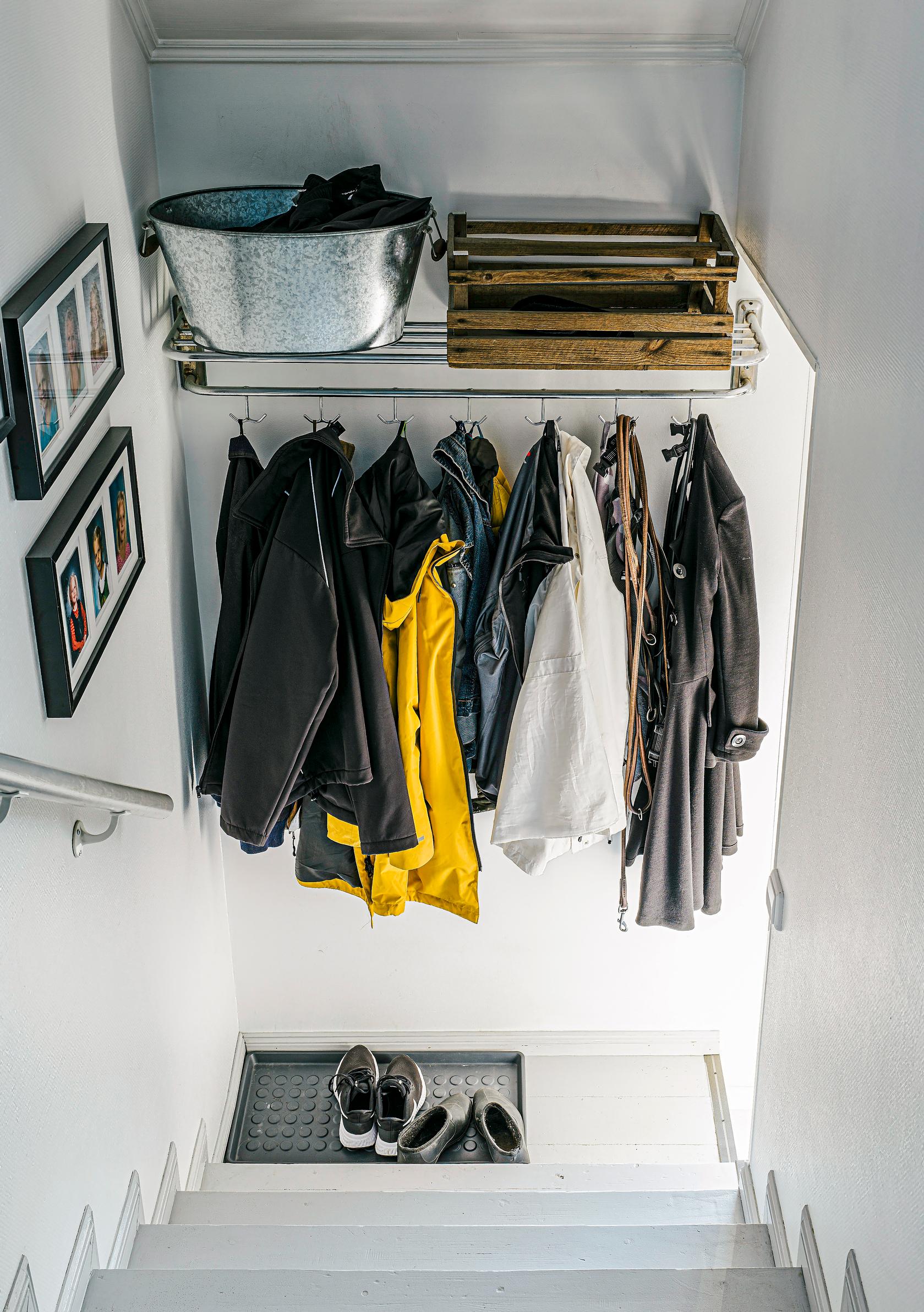 A shelf installed near the ceiling in the entryway