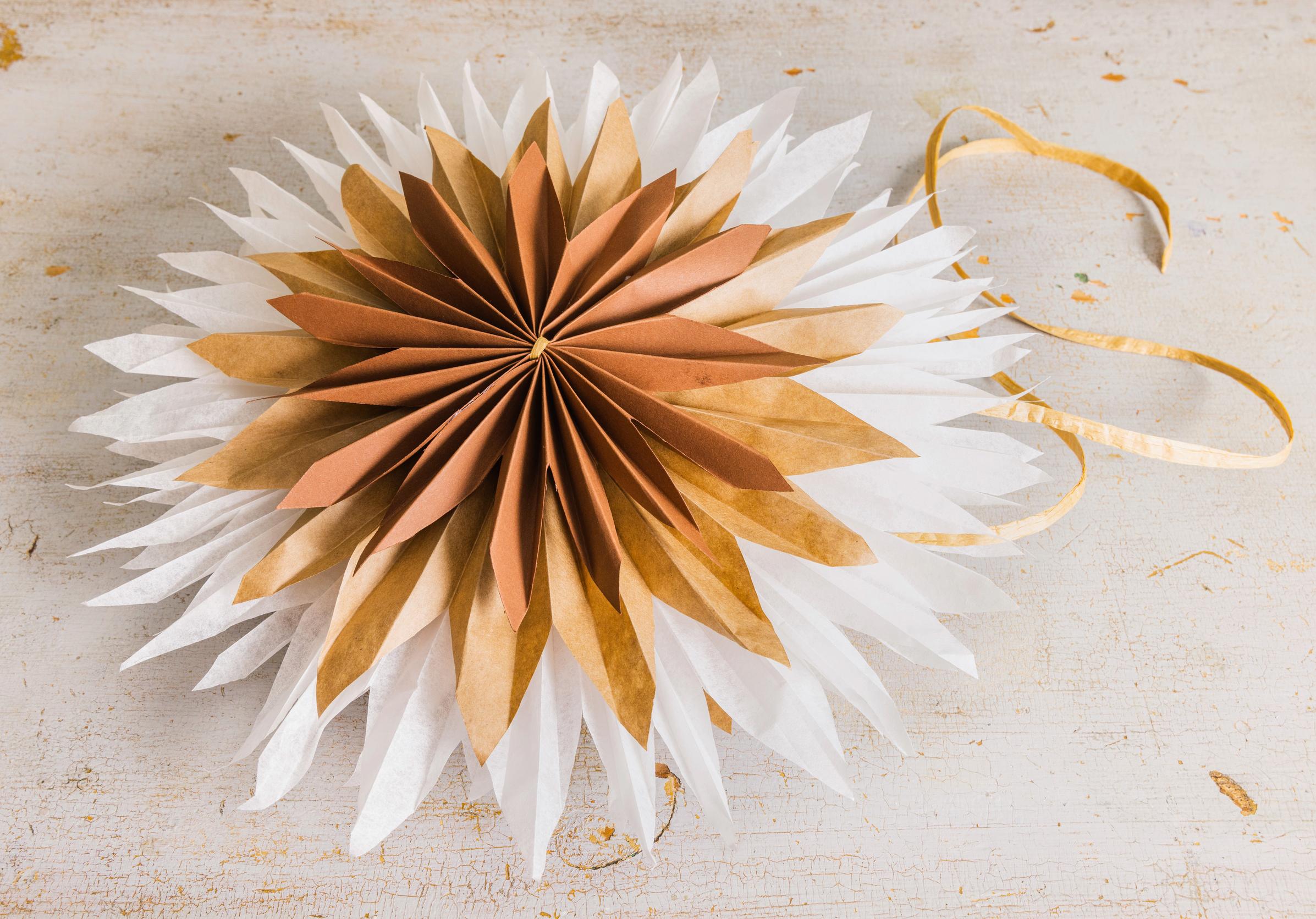 The completed layered star resting on a table.