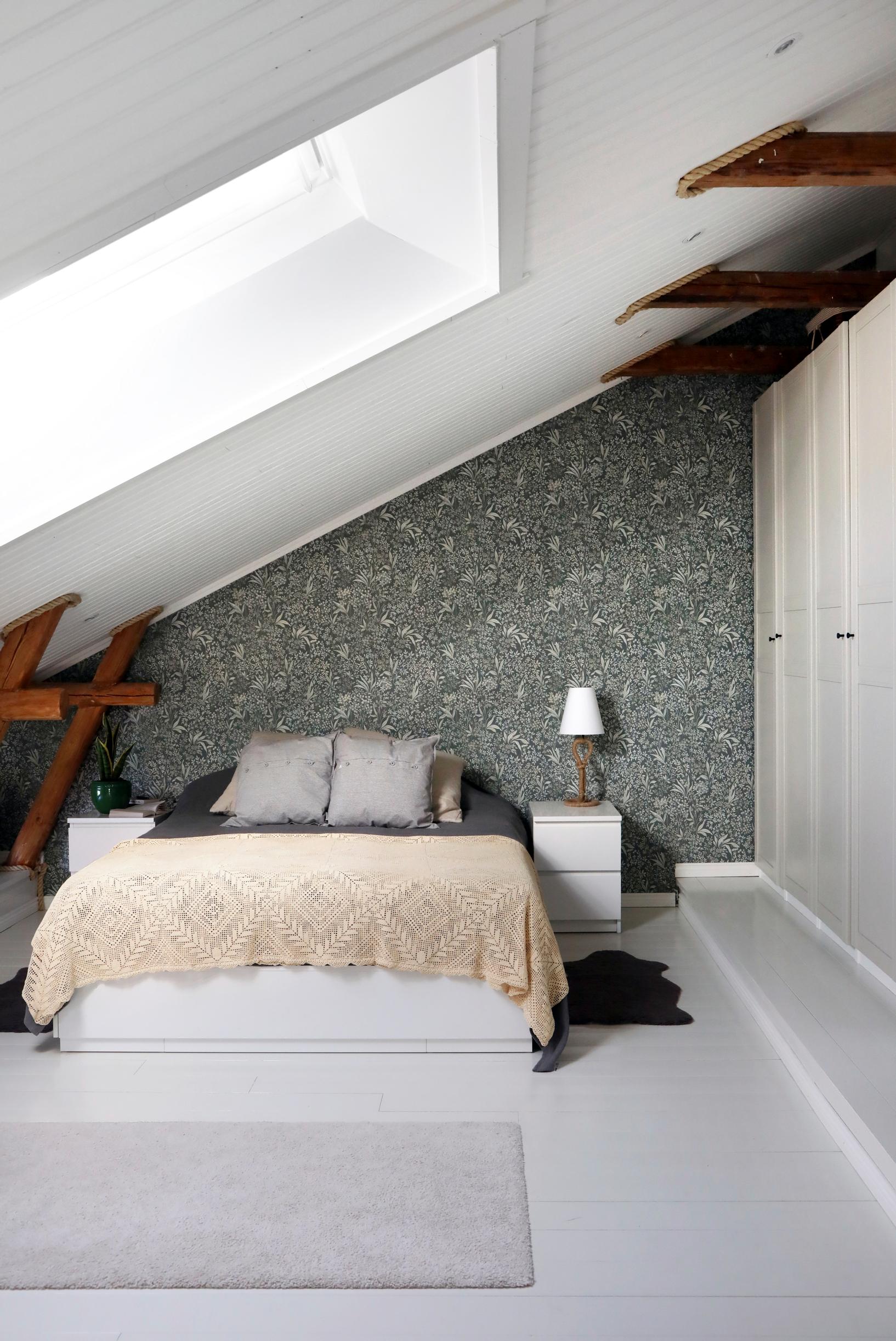 Bedroom under a slanted ceiling