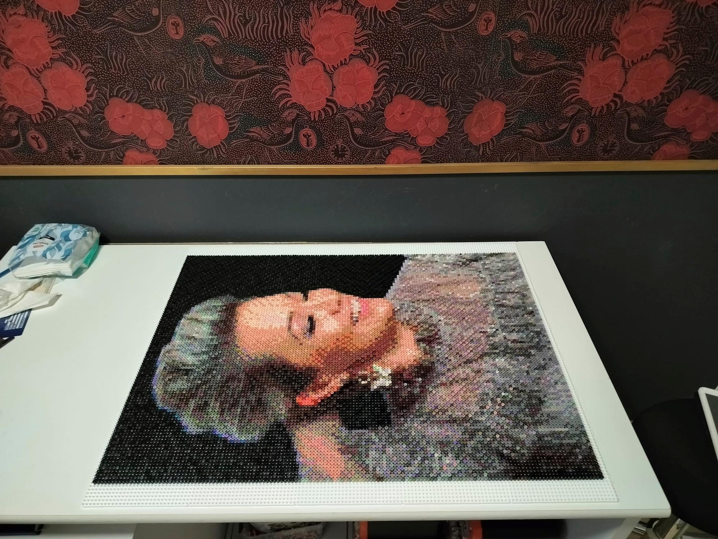 Finished Hama bead portrait of Annika Eklund on a table
