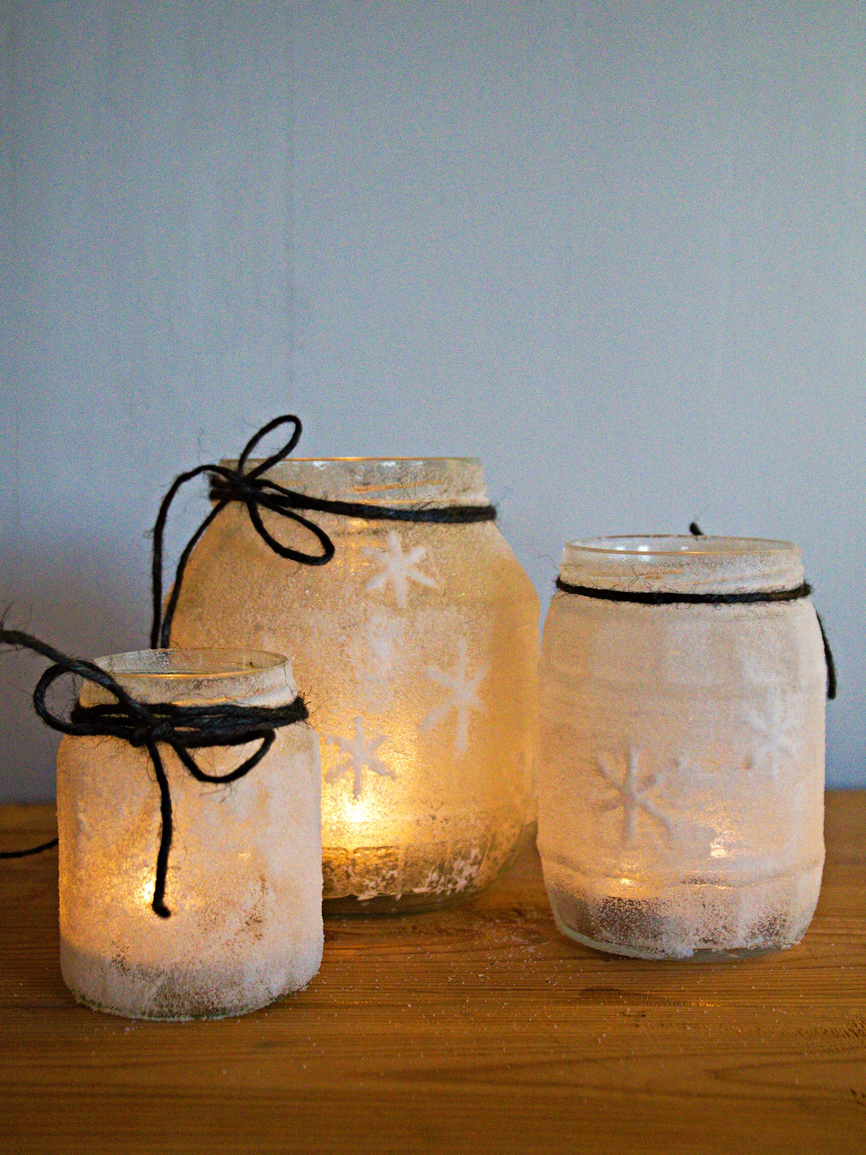 Craft a frosted salt lantern from a jar with glue and salt