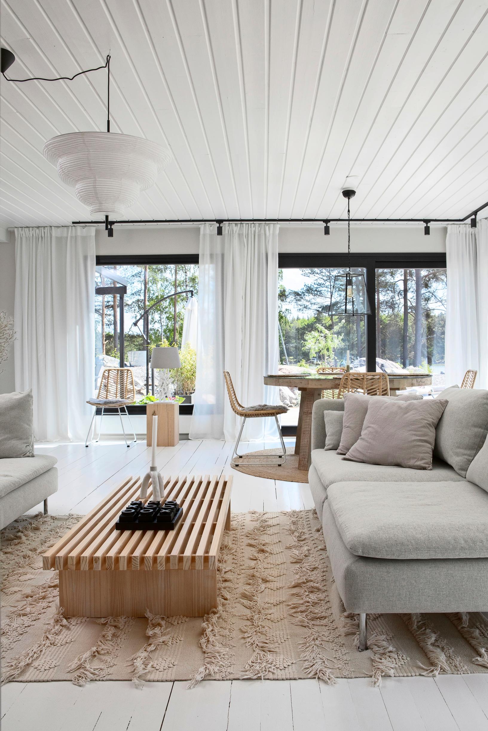 A comfortable sitting area with two sofas and a slatted table