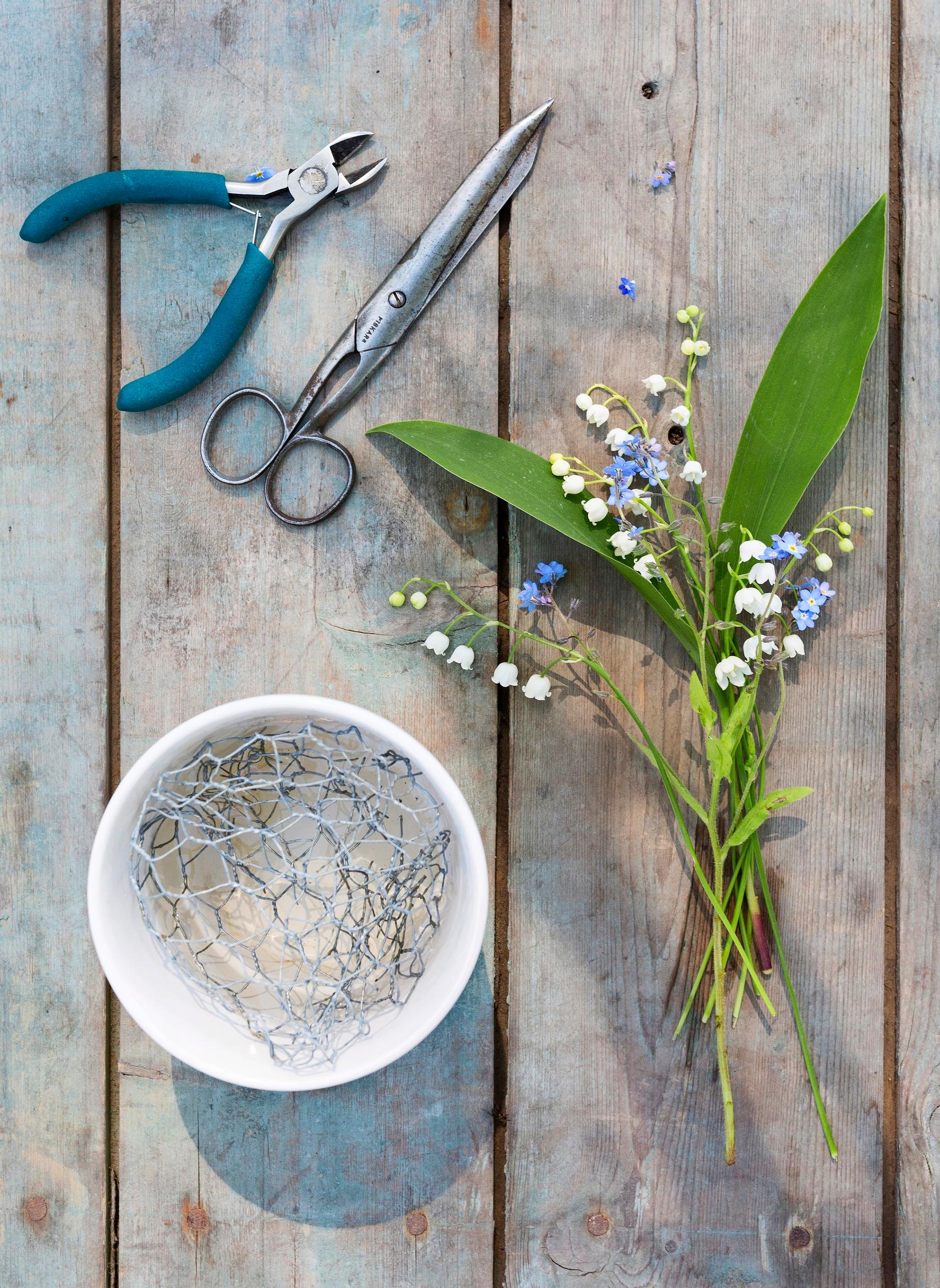 Flower scissors and chicken wire for supporting the flowers