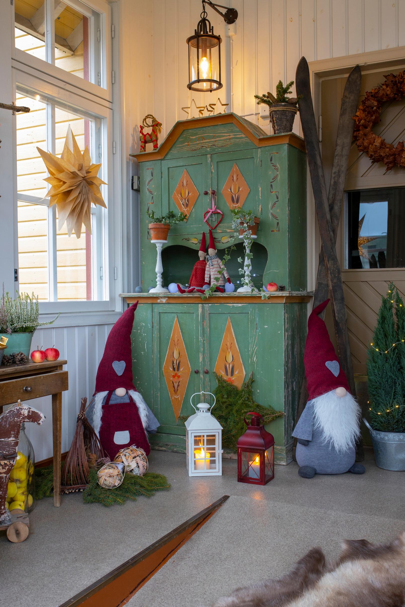 A green cabinet and elf decorations