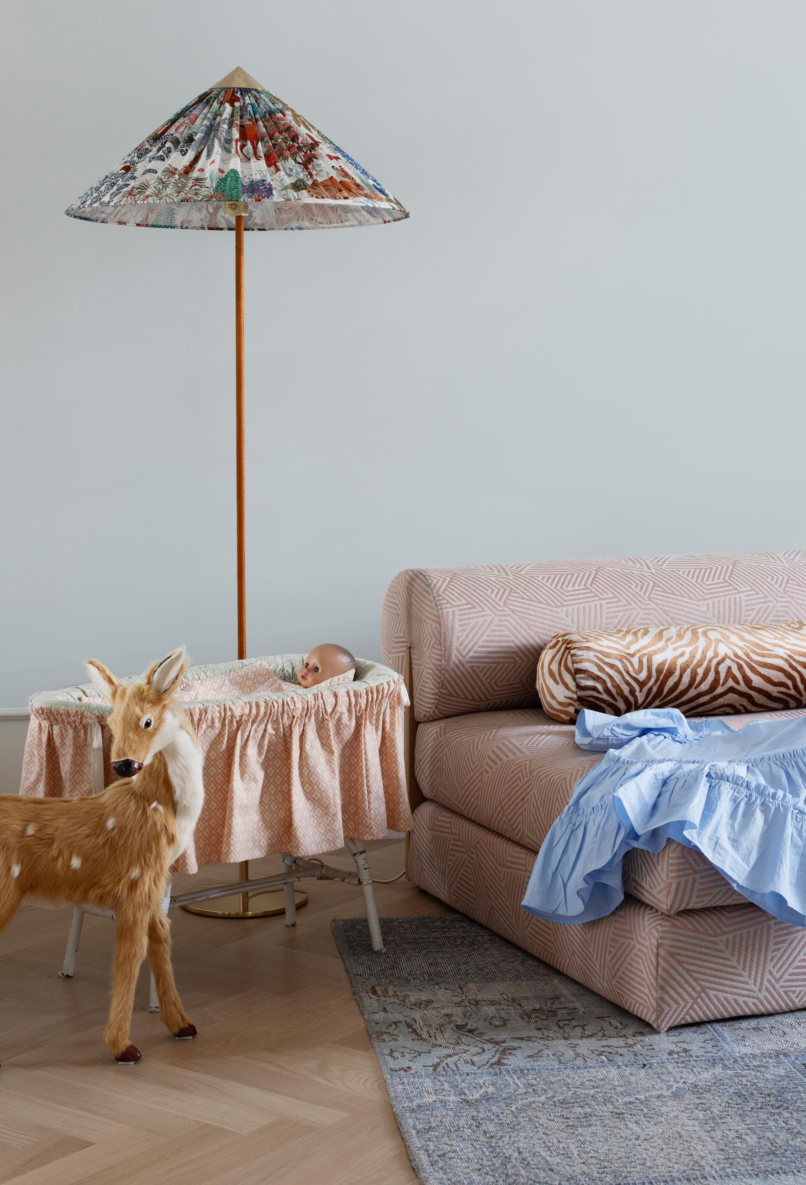 In the children’s room, the 9602 floor lamp by Paavo Tynell, and a doll’s bed made by grandmother.