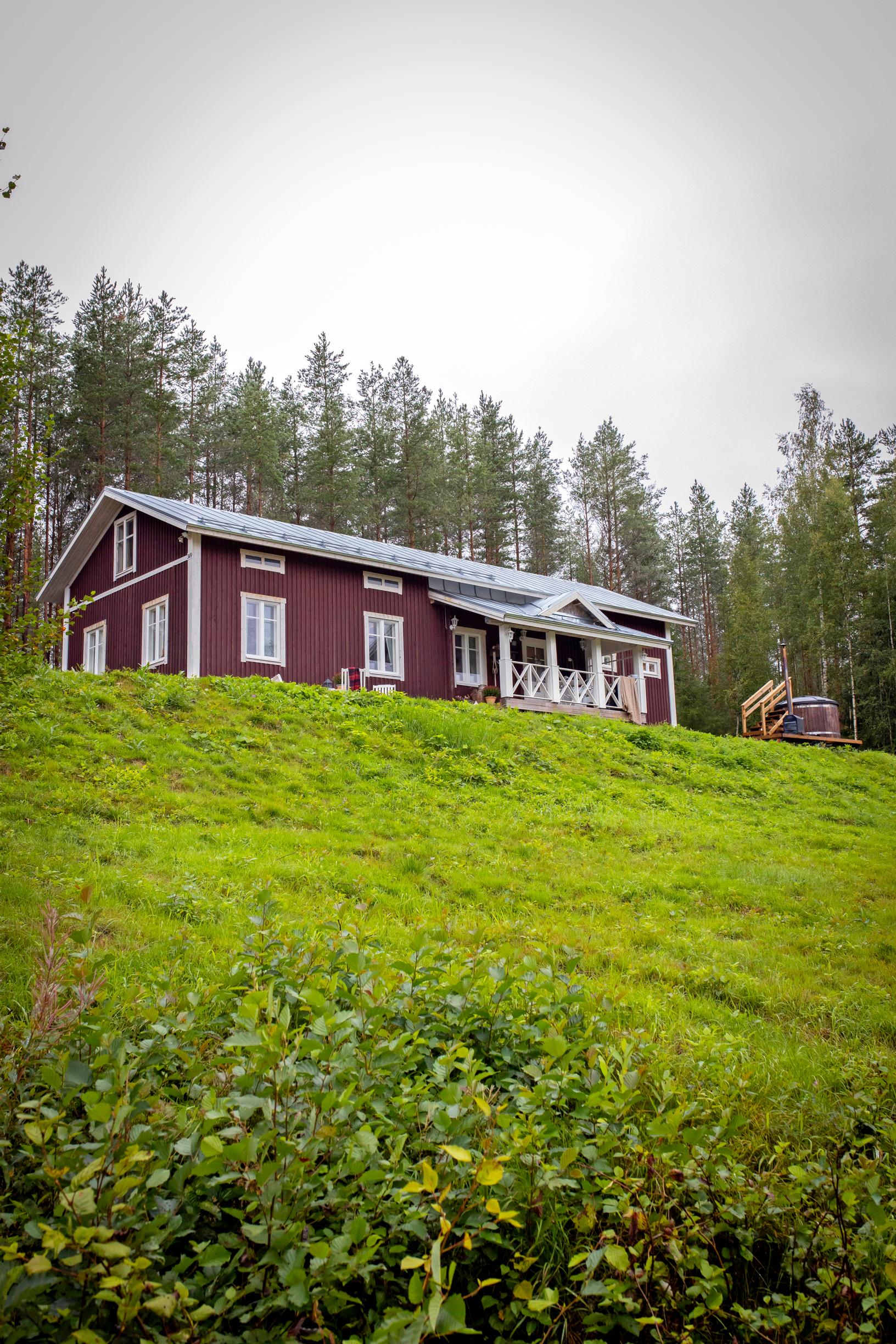 A 19th-century log house on a hill