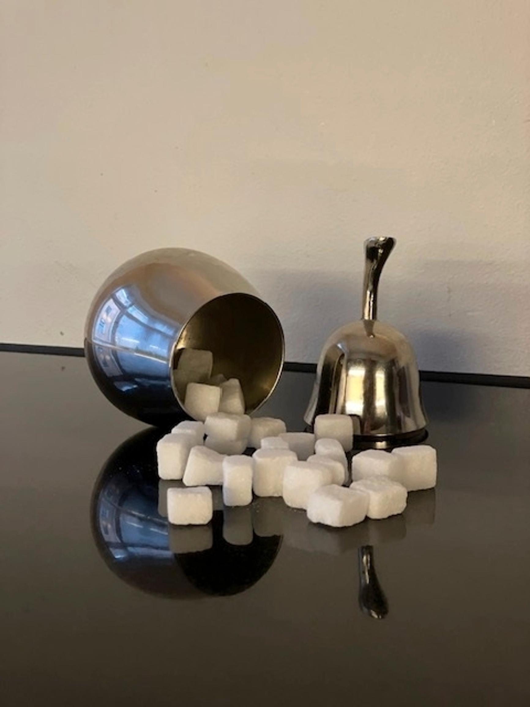 A pear-shaped sugar bowl