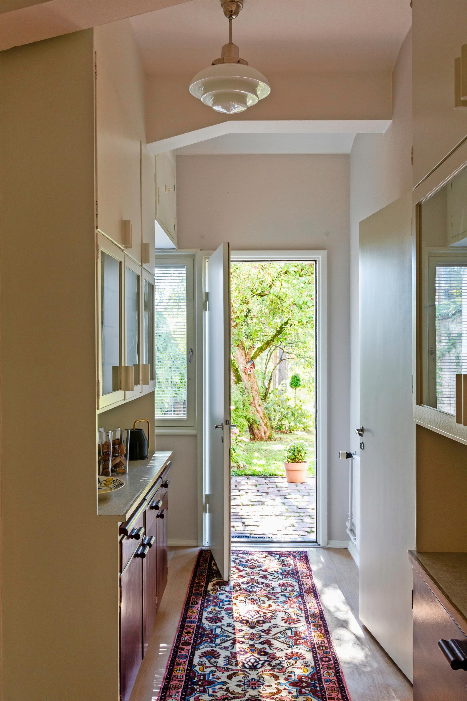 At the end of the serving corridor, a door opens to the garden