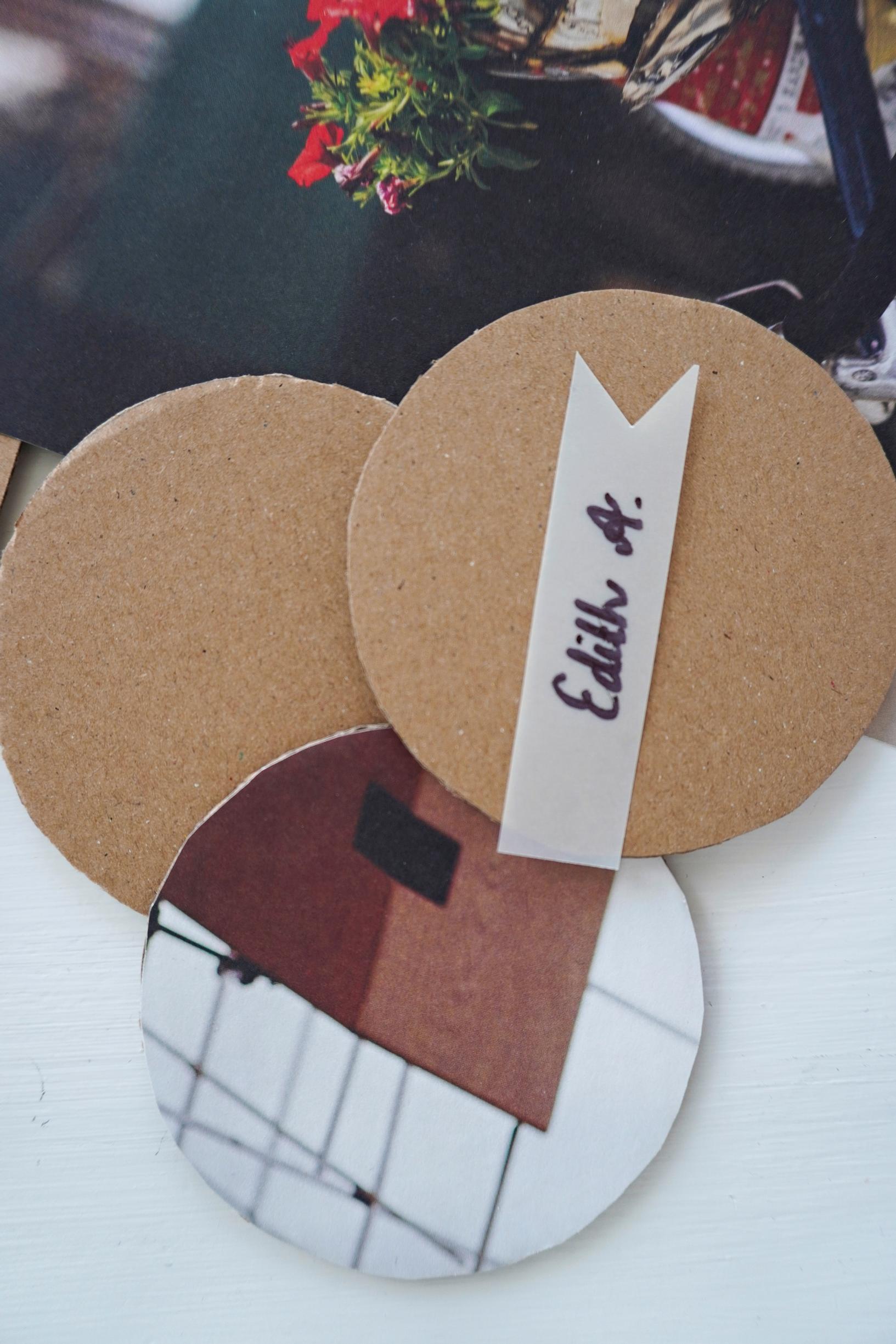 Place cards: circles cut from paper and cardboard, plus a tracing paper strip for the name