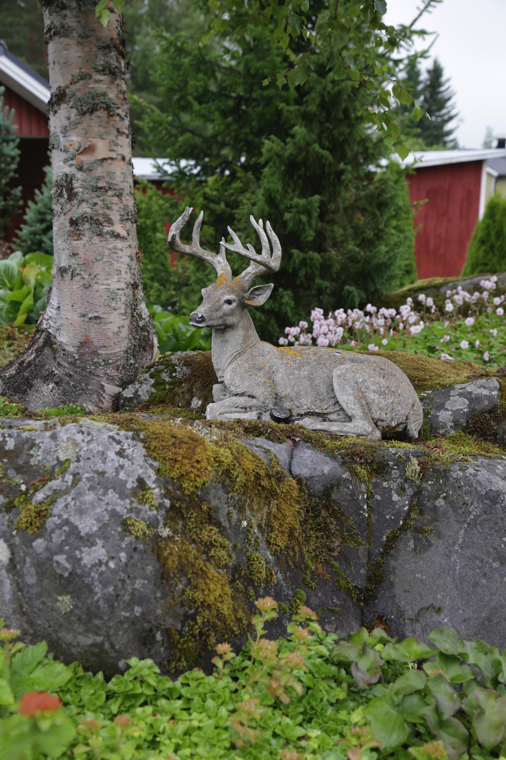 Garden ornament on a mossy stone