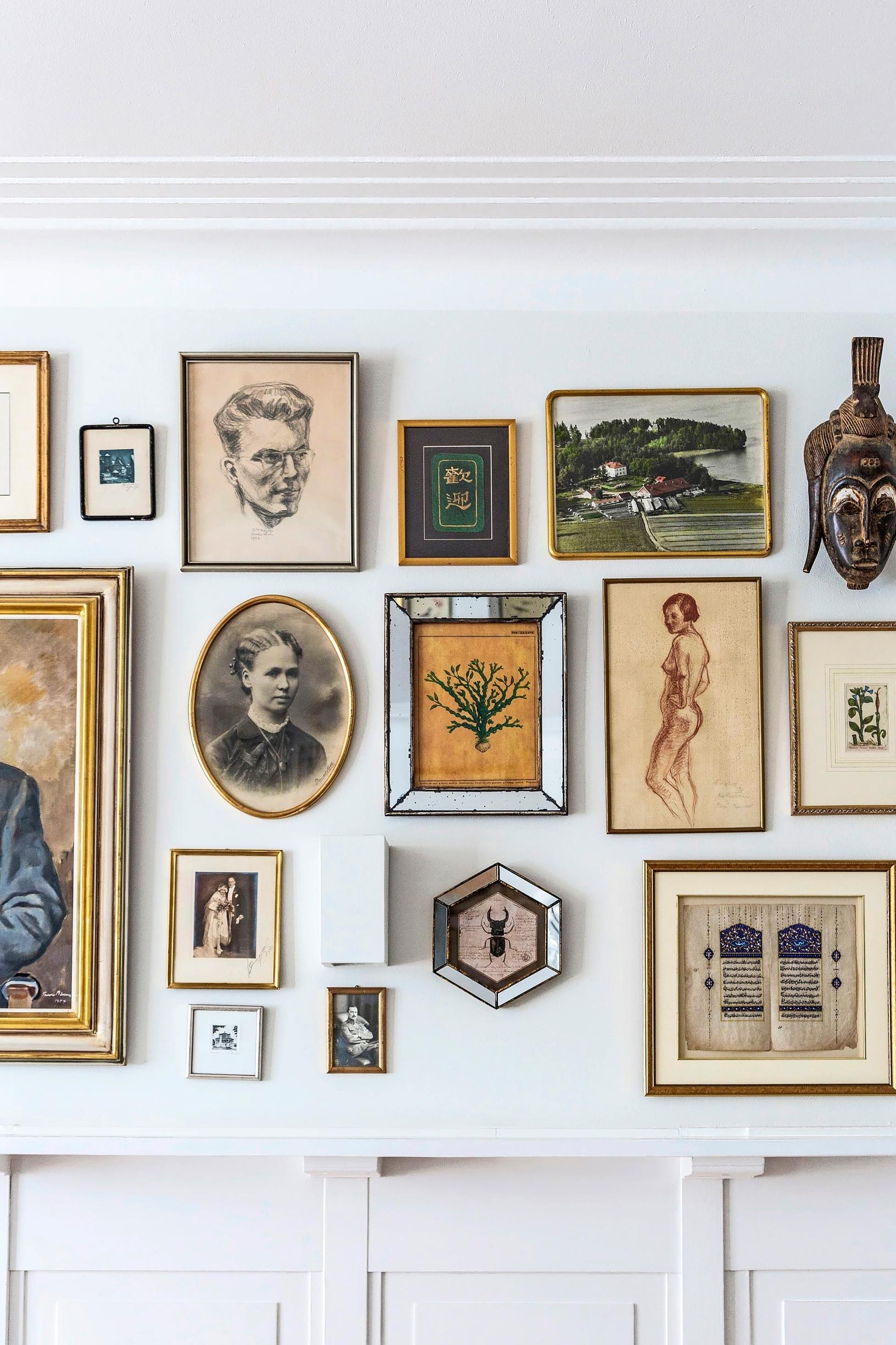 Old, varied shapes and styles of paintings arranged into a composition