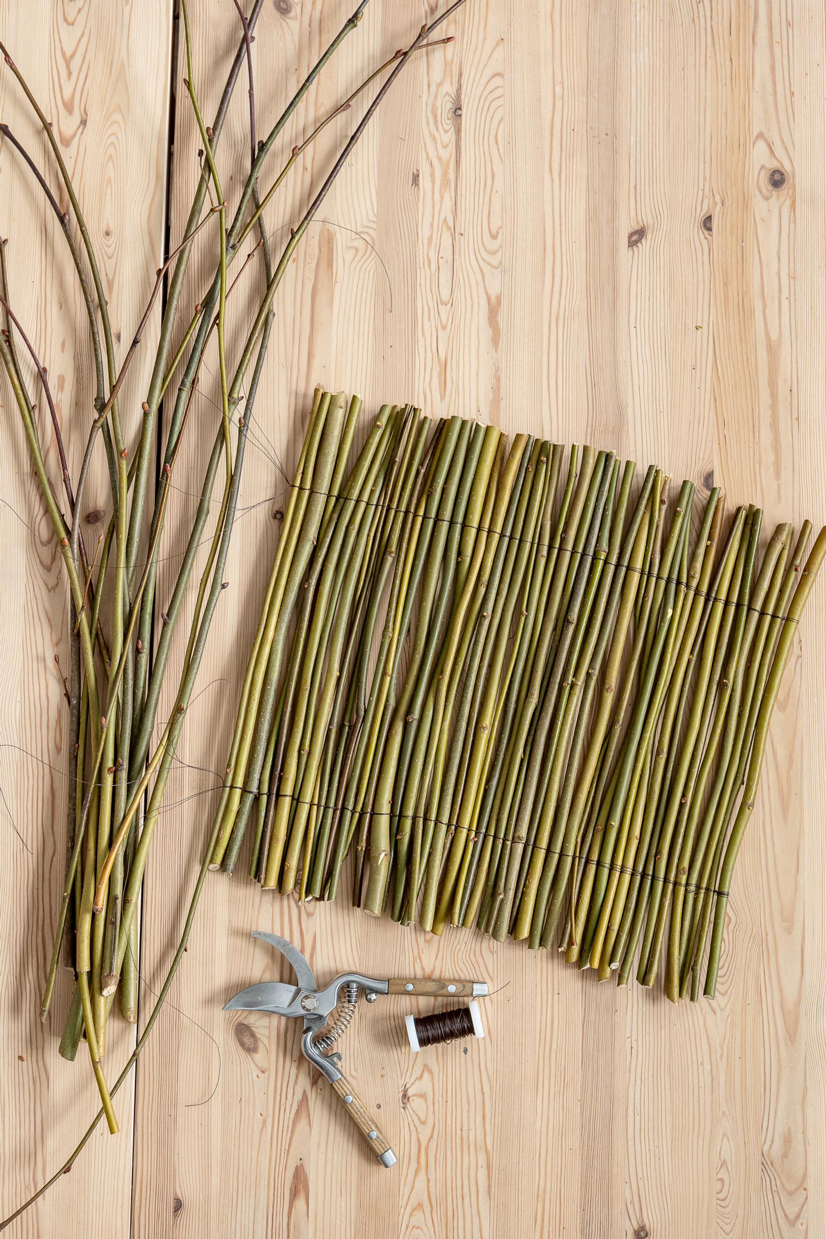 Step‑by‑step photo: a twig mat tied from linden tree suckers.