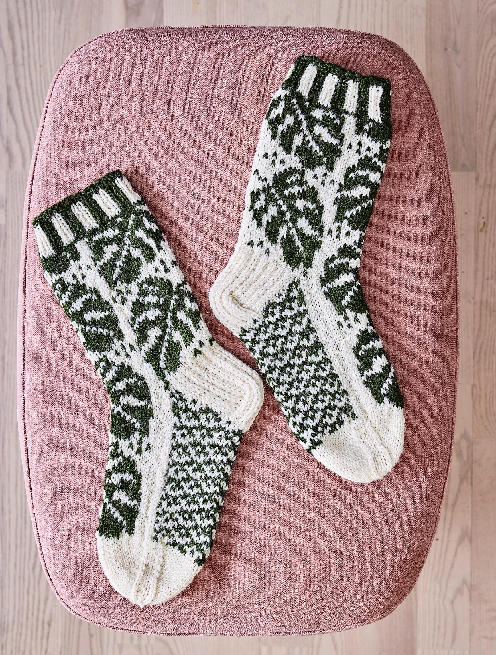 Colorwork Monstera Socks on a surface