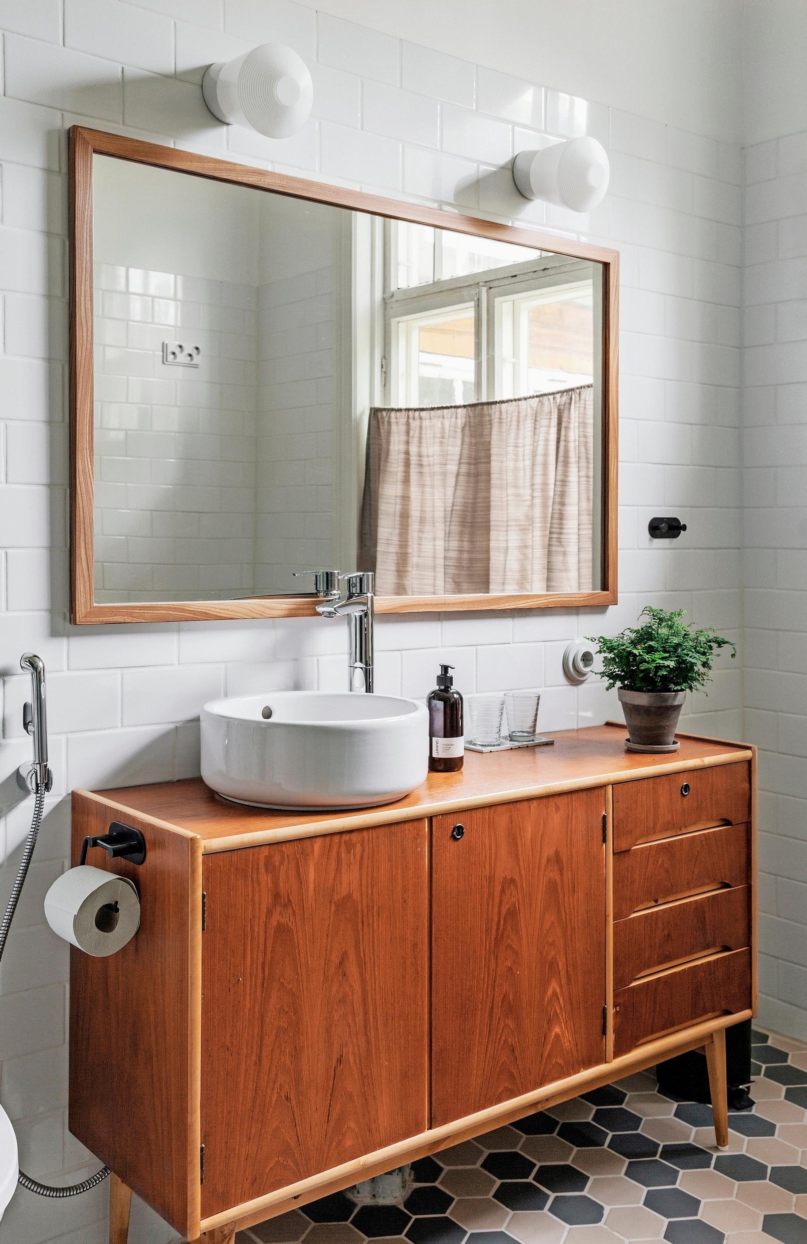 A vintage sideboard repurposed as a bathroom vanity.