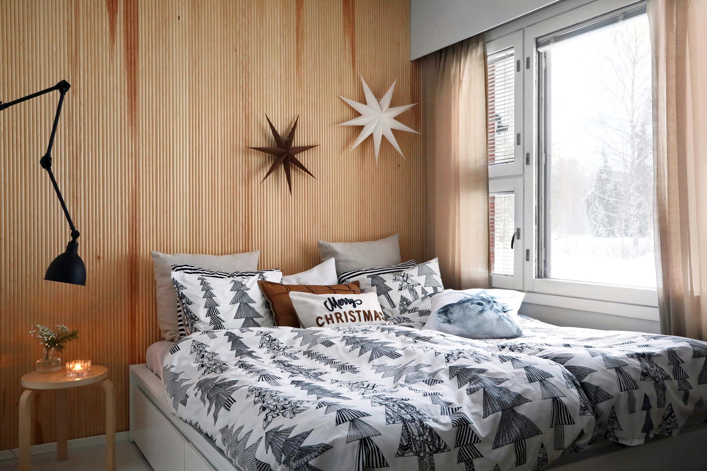 A bedroom wall covered with finger paneling