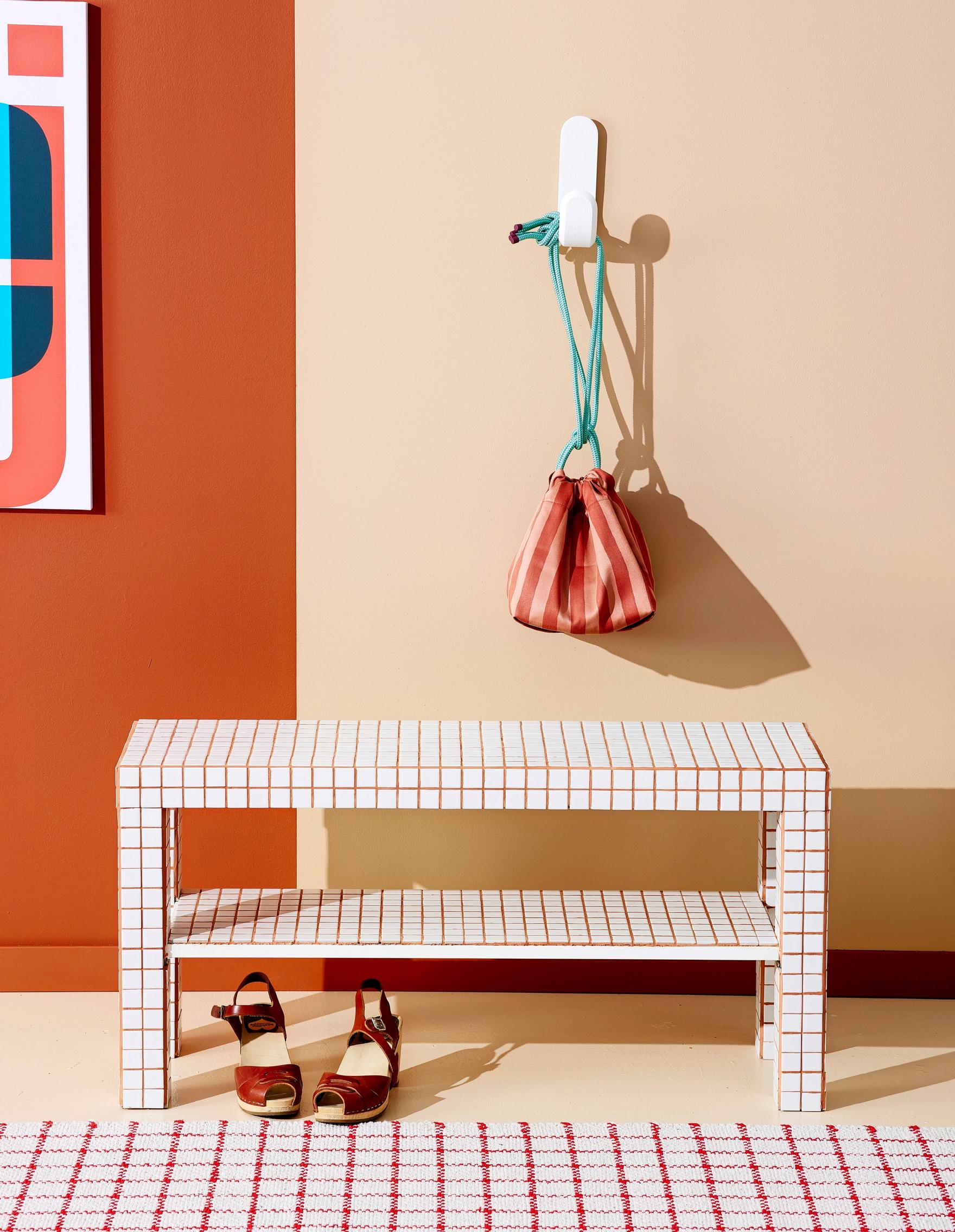 A bench covered with tiles
