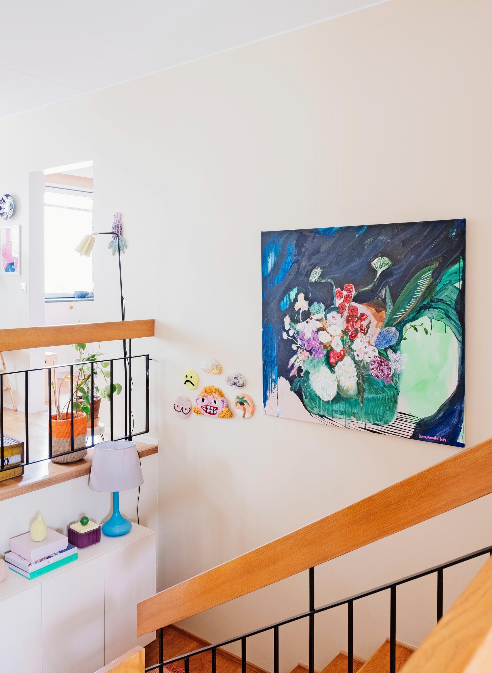 A spacious staircase showcasing a colorful painting